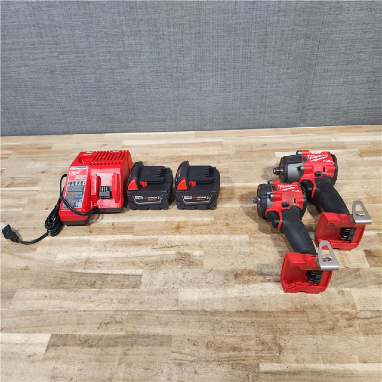 HOUSTON LOCATION - AS-IS MILWAUKEE 2 TOOL COMBO KIT W/ (2) BATTERY & CHARGER