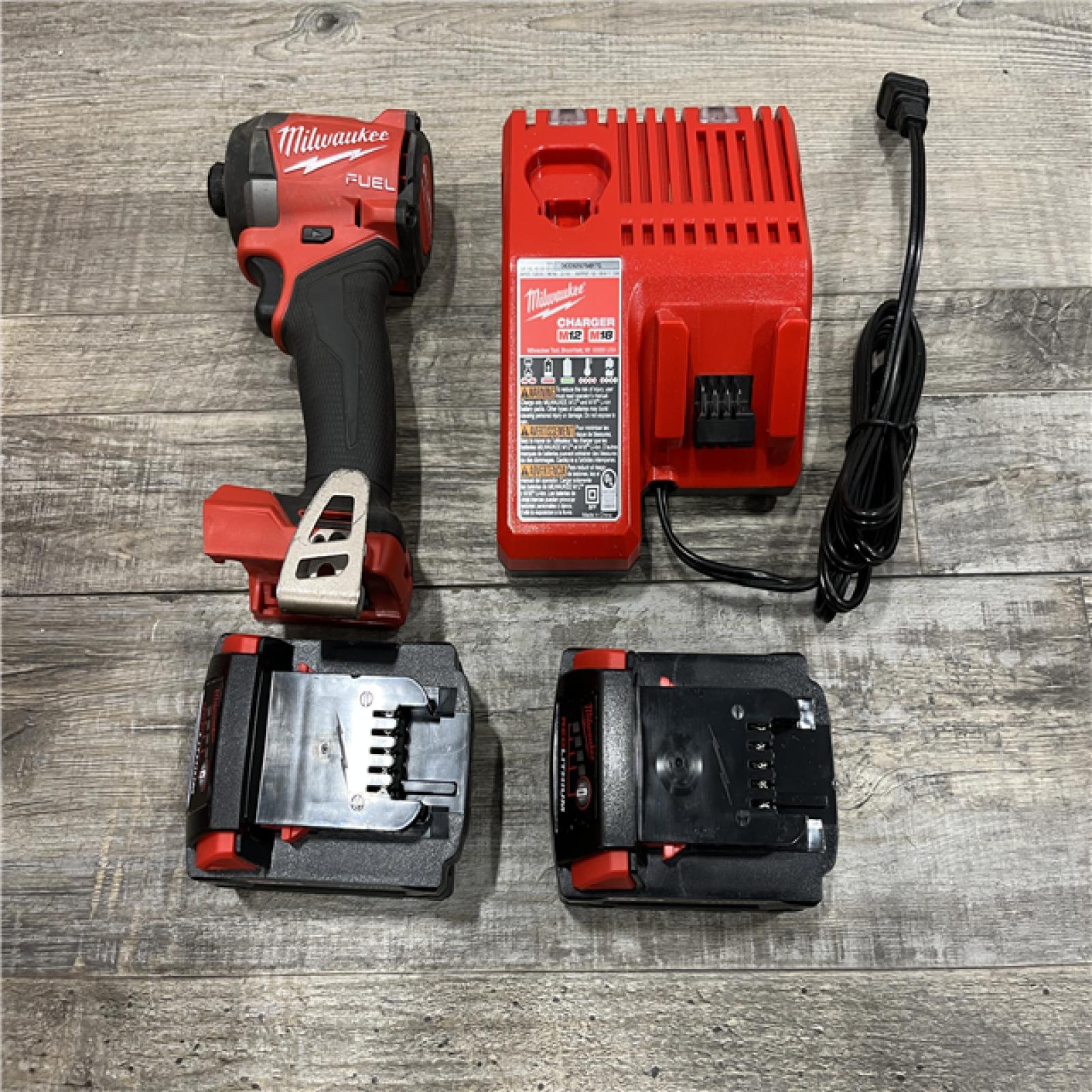 AS-IS Milwaukee FUEL 18V Lithium-Ion Brushless Cordless 1/4 in. Hex Impact Driver Kit