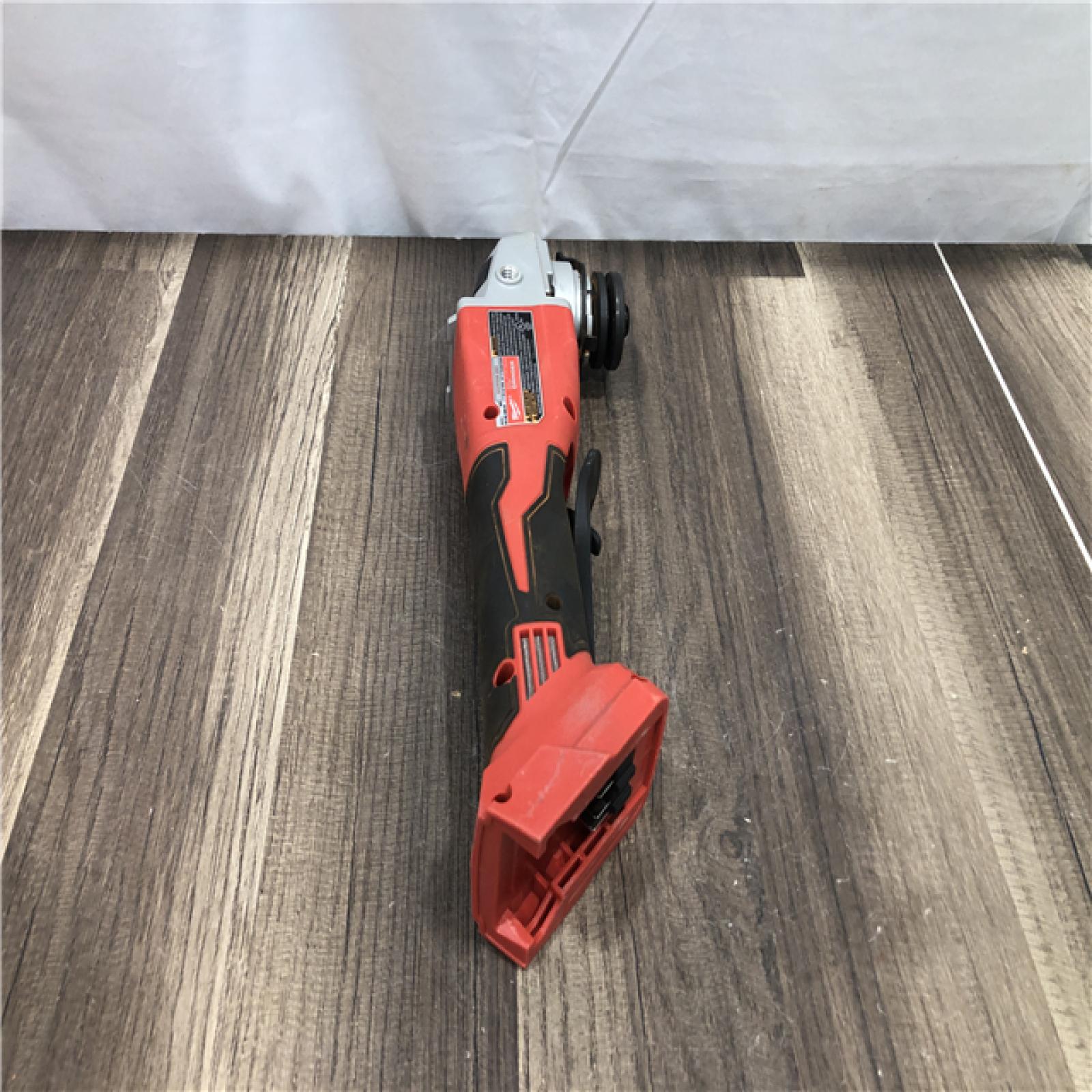 AS-IS Milwaukee 18V Lithium-Ion Brushless Cordless 4-1/2 in./5 in. Grinder w/Paddle Switch (Tool-Only)