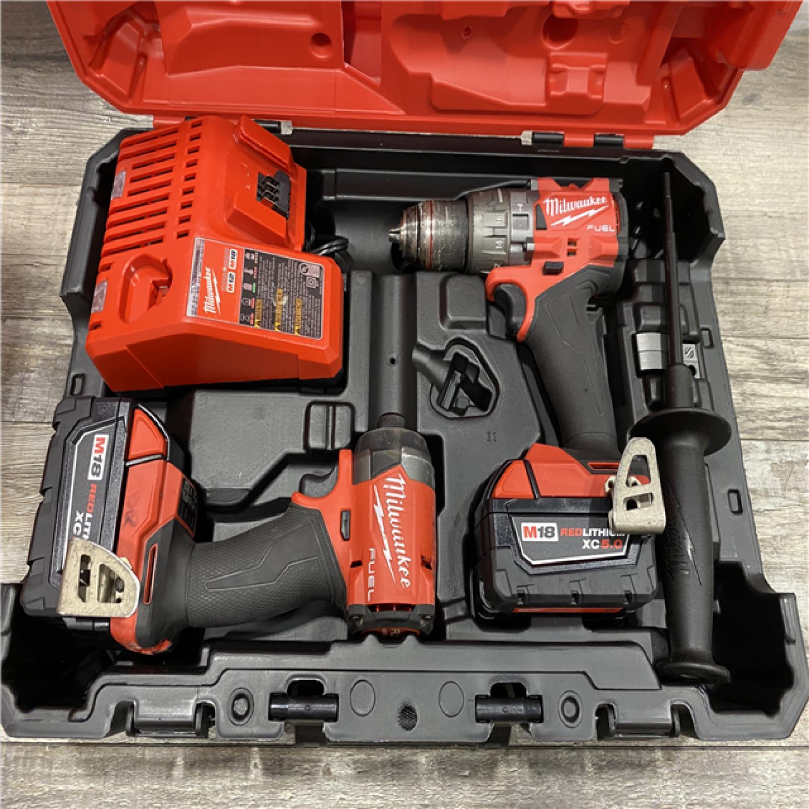 AS-IS Milwaukee FUEL 18V Lithium-Ion Brushless Cordless Hammer Drill and Impact Driver Combo Kit