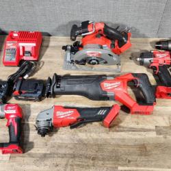 HOUSTON LOCATION - AS-IS (APPEARS LIKE NEW) Milwaukee M18 FUEL 18V Lithium-Ion Brushless Cordless Combo Kit with Two 5.0 Ah Batteries  1 Charger  2 Tool Bags (7-Tool)
