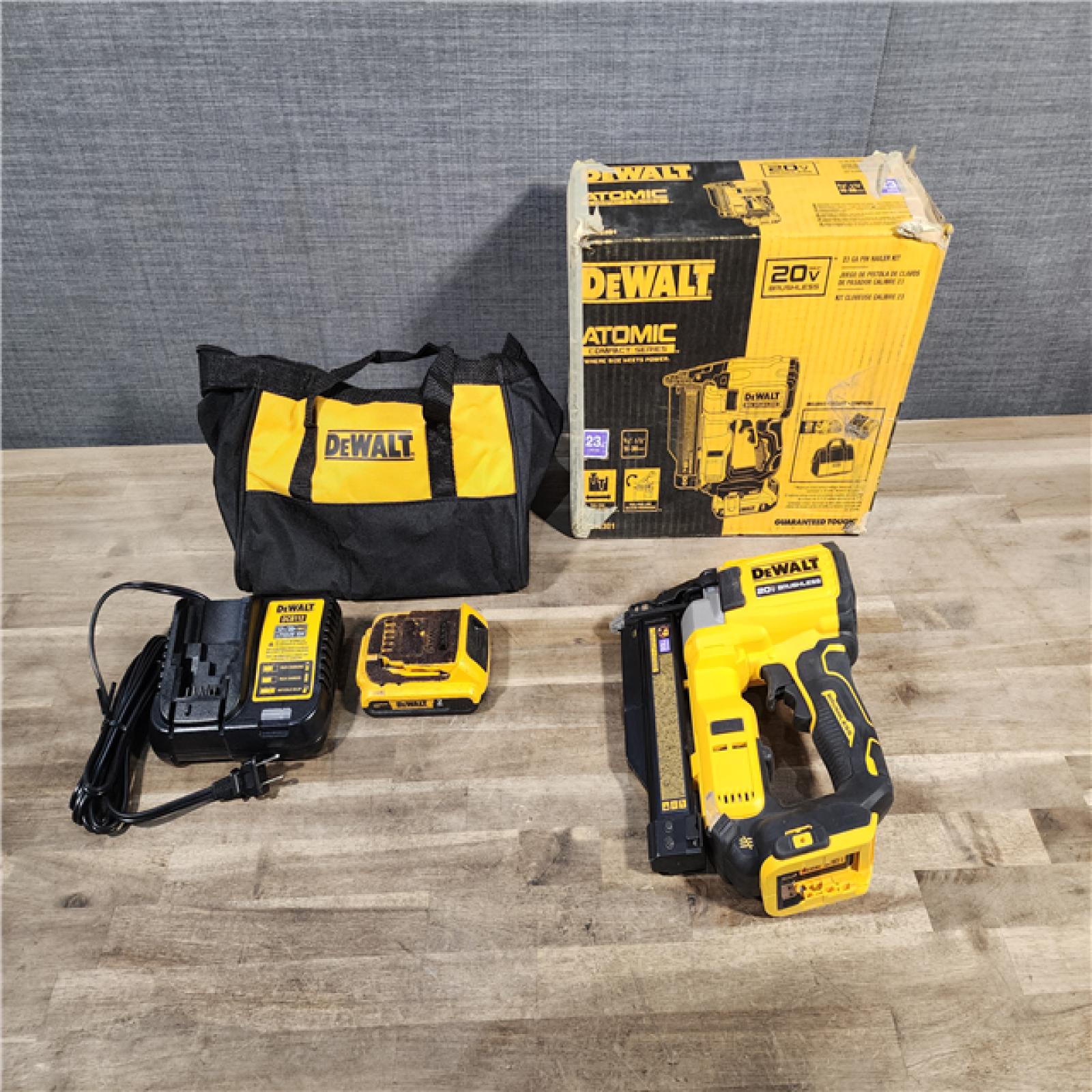 HOUSTON LOCATION - AS-IS DEWALT ATOMIC 20V MAX Lithium Ion Cordless 23 Gauge Pin Nailer Kit with 2.0Ah Battery and Charger