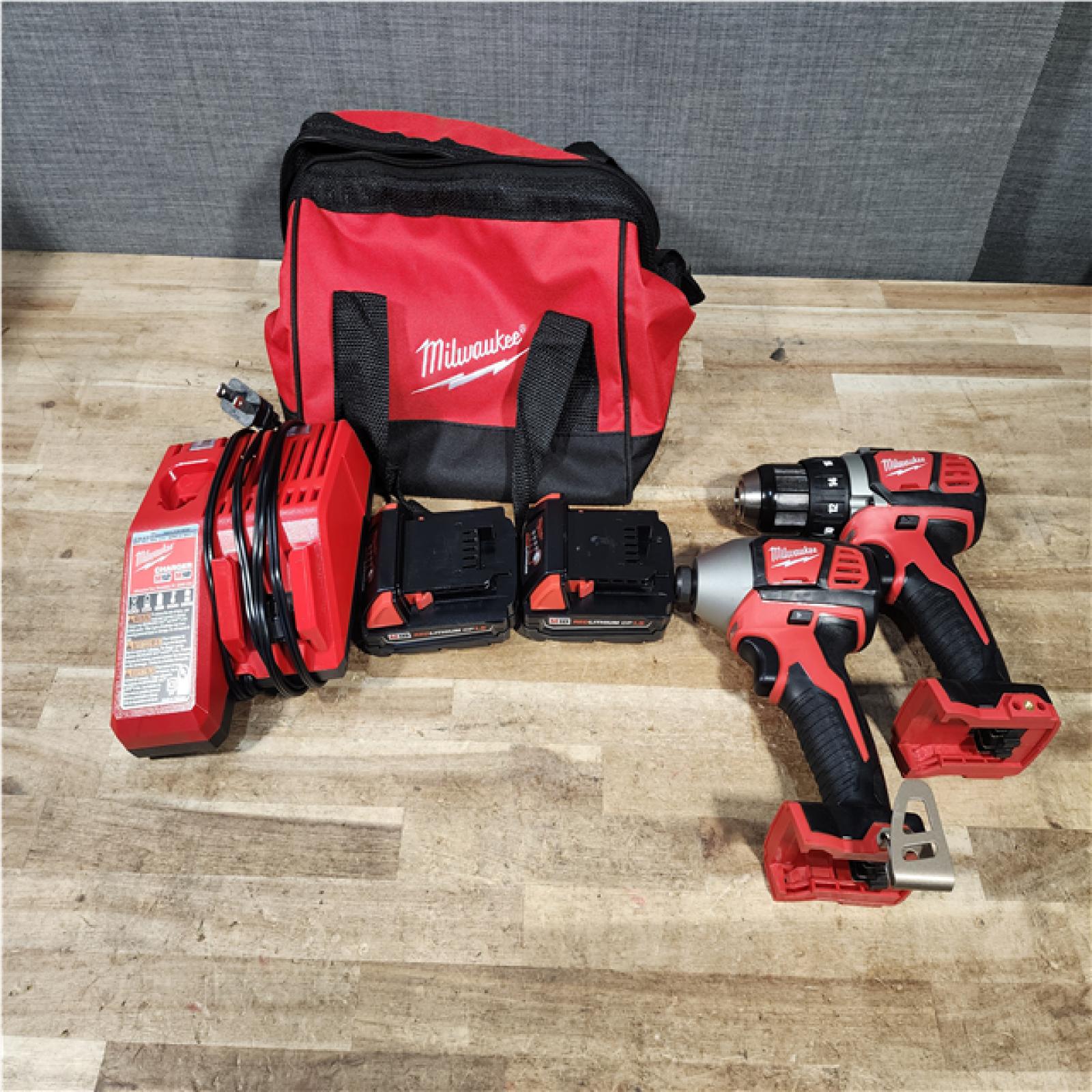 HOUSTON LOCATION - AS - IS Milwaukee 18V Lithium-Ion Cordless Drill Driver/Impact Driver Combo Kit