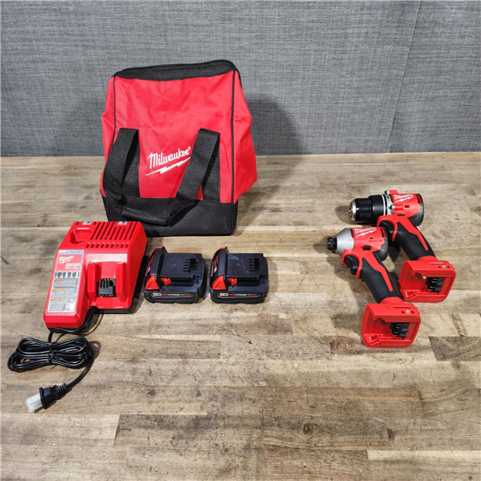 HOUSTON LOCATION - AS-IS Milwaukee M18 18V Lithium-Ion Brushless Cordless Compact Drill/Impact Combo Kit (2-Tool) W/(2) 2.0 Ah Batteries  Charger & Bag
