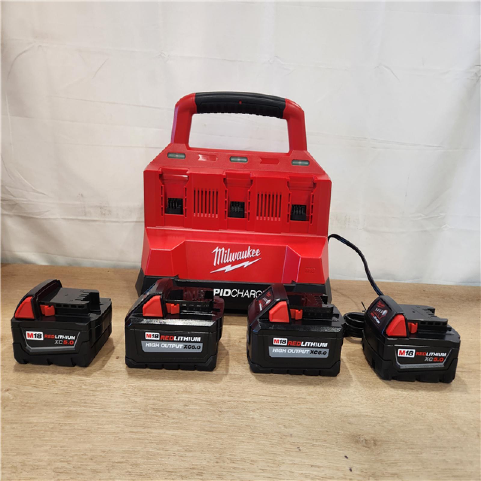 AS-IS- Milwaukee 18-Volt Lithium-Ion Battery Pack (2) 5.0Ah and High Output Battery Pack (2) 6.0Ah with PACKOUT 6-Port Rapid Charger