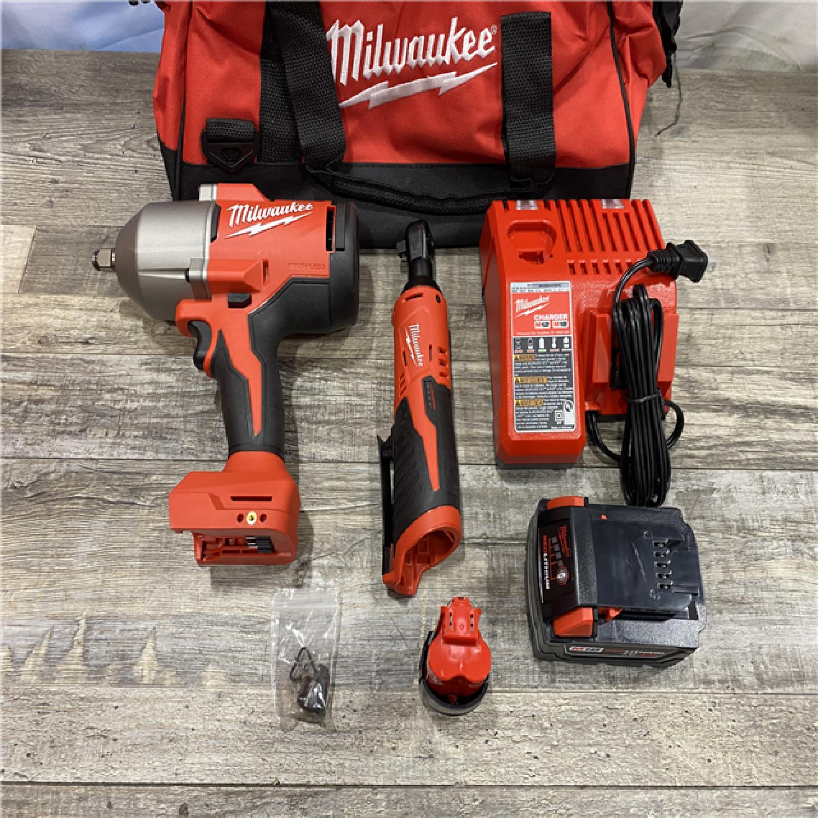AS-IS Milwaukee 12/18V Lithium-Ion Cordless 3/8 in. Ratchet and 1/2 in. High Torque Impact Wrench with Friction Ring Combo Kit