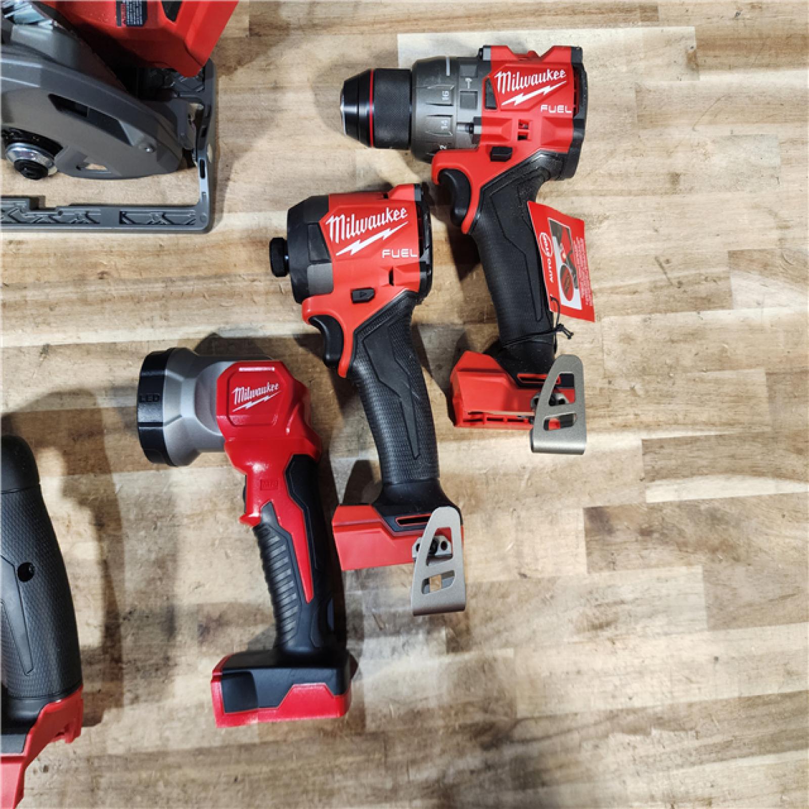 HOUSTON LOCATION - AS-IS (APPEARS LIKE NEW) Milwaukee M18 FUEL 18V Lithium-Ion Brushless Cordless 5-Tool Combo Kit with Two 5.0 Ah Batteries  1 Charger 1 Tool Bag