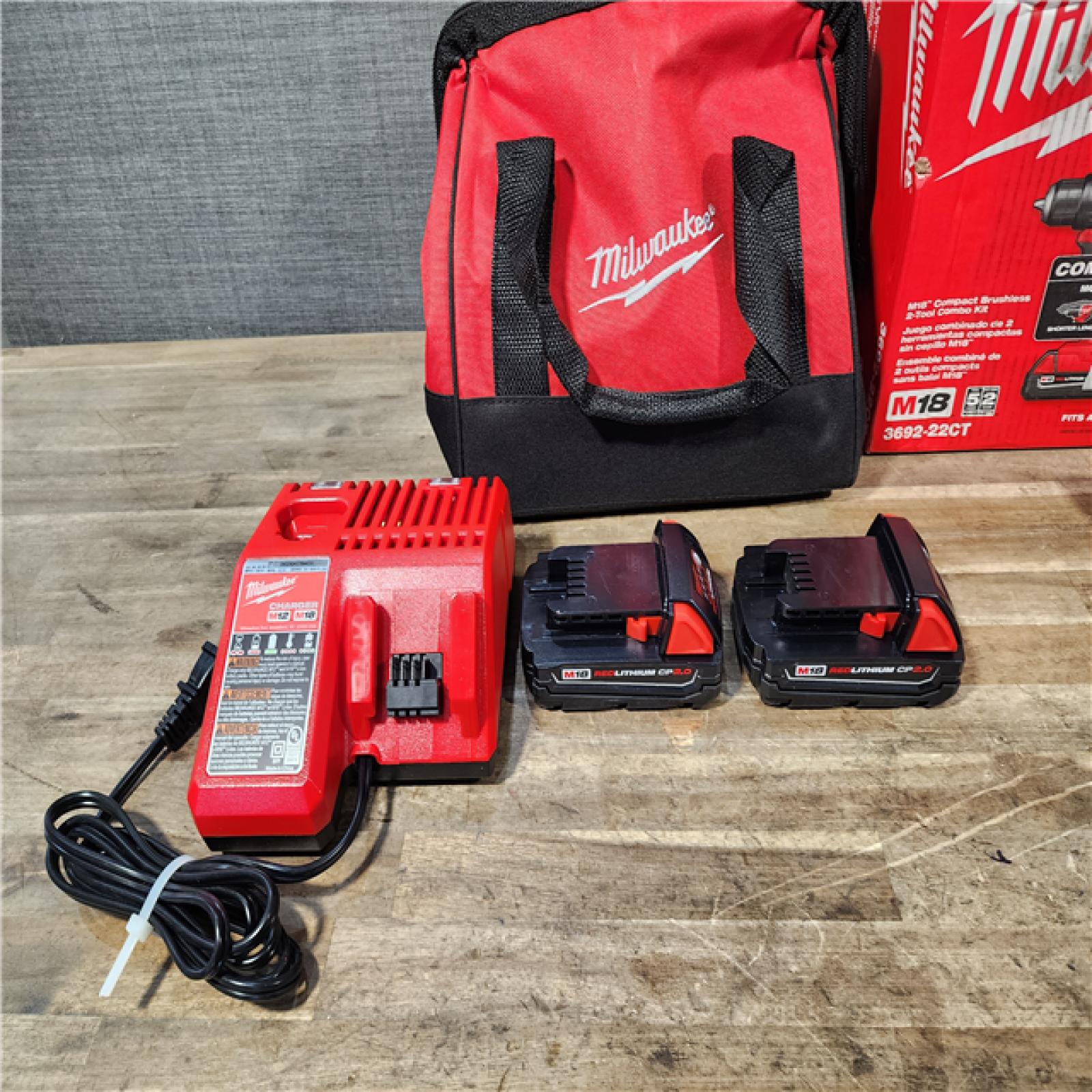 HOUSTON LOCATION - AS-IS Milwaukee M18 18V Lithium-Ion Brushless Cordless Compact Drill/Impact Combo Kit (2-Tool) W/(2) 2.0 Ah Batteries  Charger & Bag
