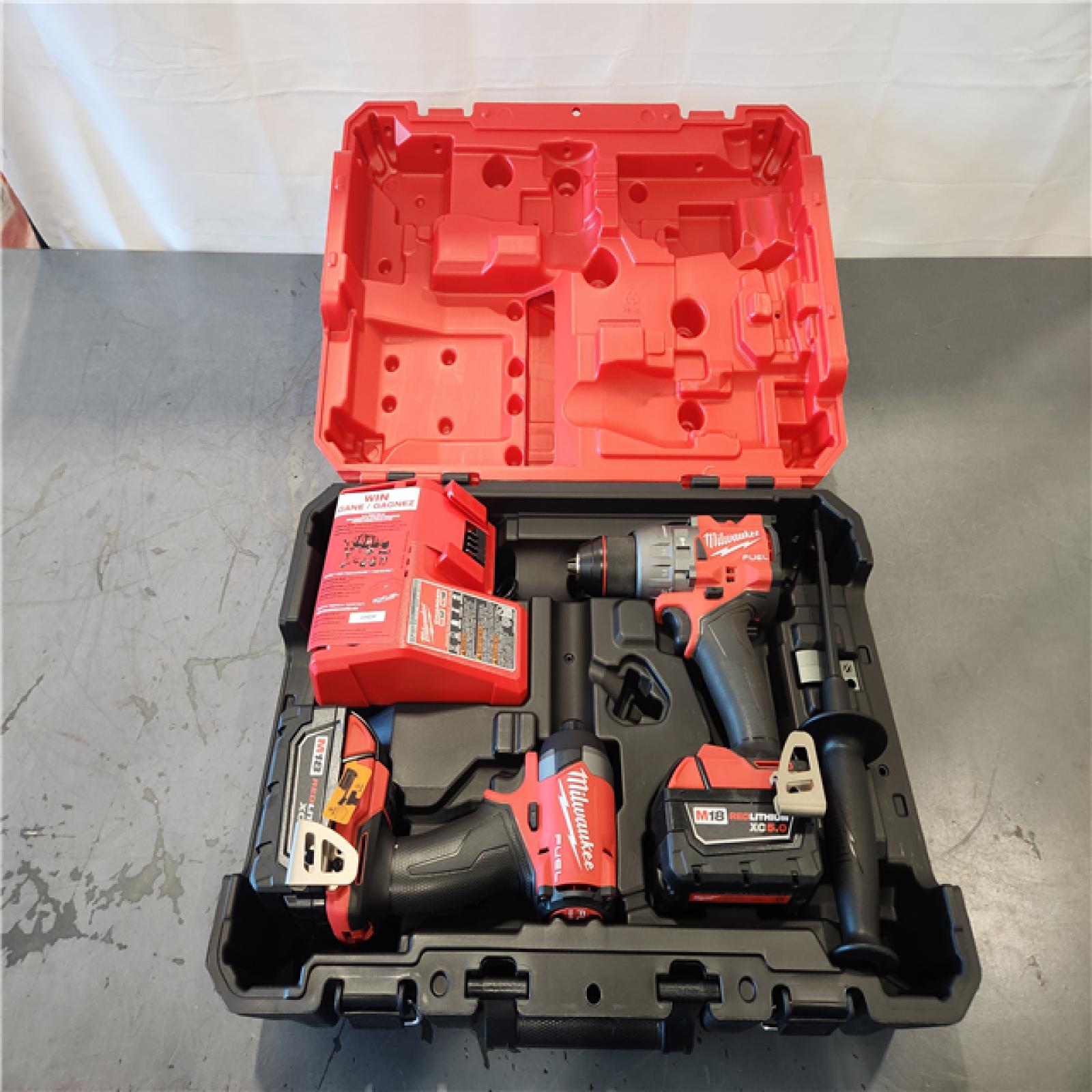 AS-IS- Milwaukee FUEL 18V Lithium-Ion Brushless Cordless Hammer Drill and Impact Driver Combo Kit