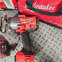 Houston location- AS-IS Milwaukee M18 FUEL 1/2 High Torque Impact Wrench with Friction Ring Kit Appears in good condition