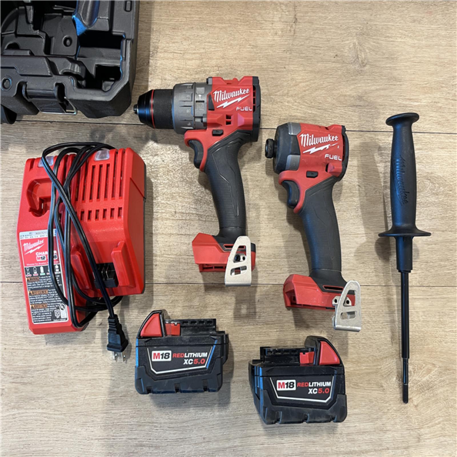 AS-IS Milwaukee FUEL 18V Lithium-Ion Brushless Cordless Hammer Drill and Impact Driver Combo Kit