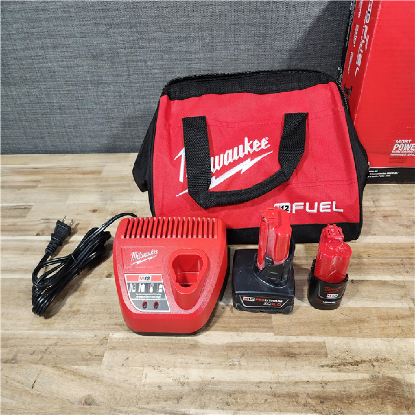 HOUSTON LOCATION - AS-IS Milwaukee FUEL 12-Volt Lithium-Ion Brushless Cordless Hammer Drill and Impact Driver Combo Kit