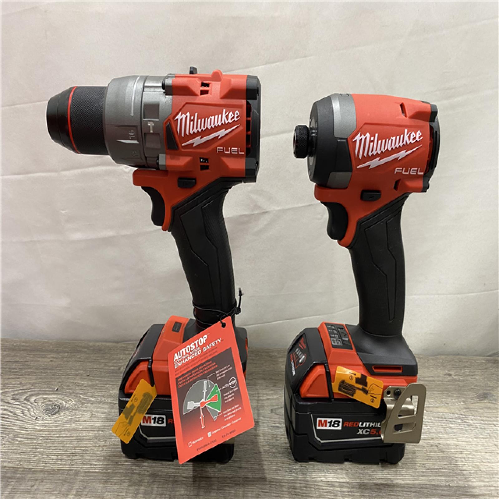 AS-IS Milwaukee FUEL 18V Lithium-Ion Brushless Cordless Hammer Drill and Impact Driver Combo Kit