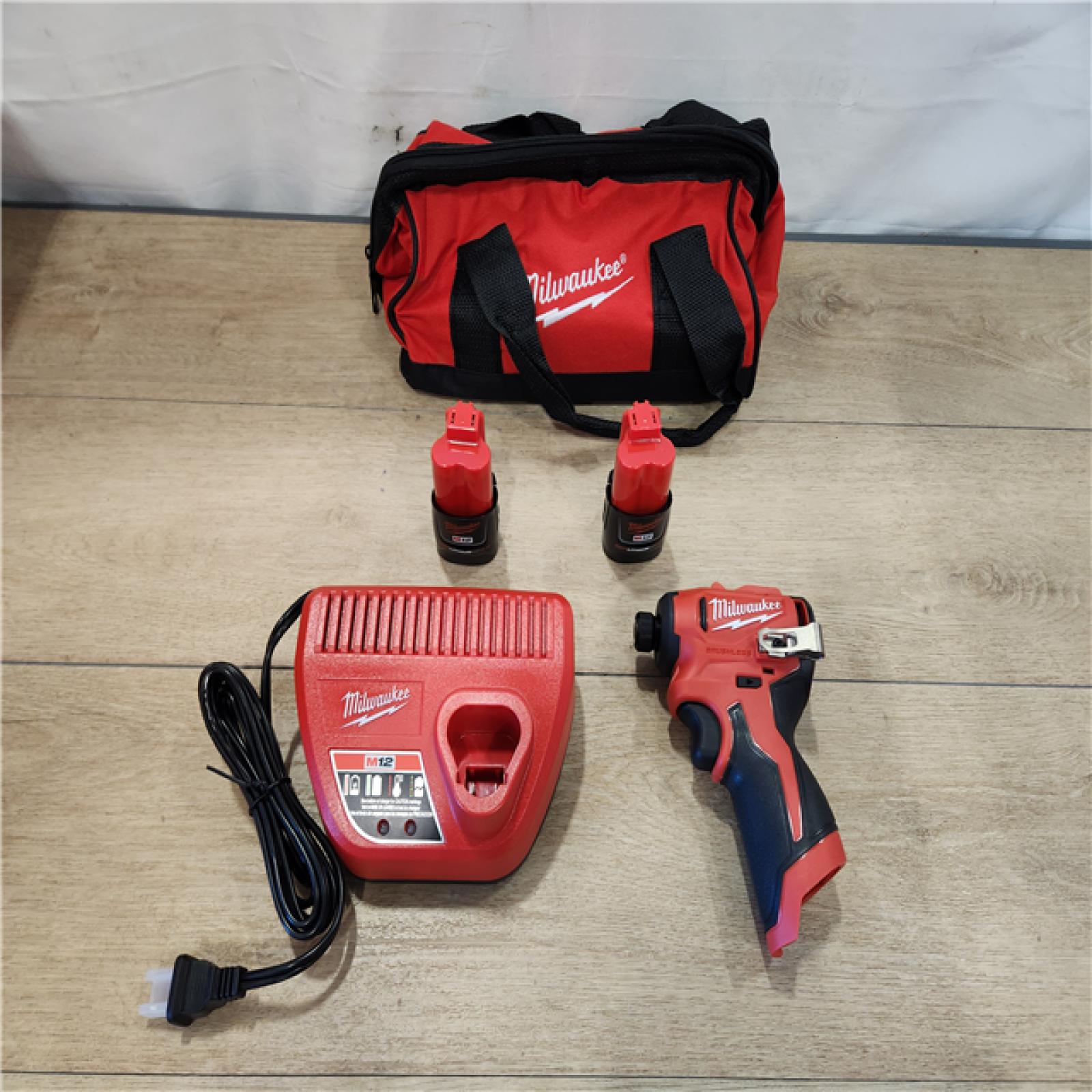 AS-IS- M12 12-Volt Lithium-Ion Compact Brushless Cordless 1/4 in. Impact Driver Kit W (2) 2.0 Ah Batteries  Charger & Tool Bag