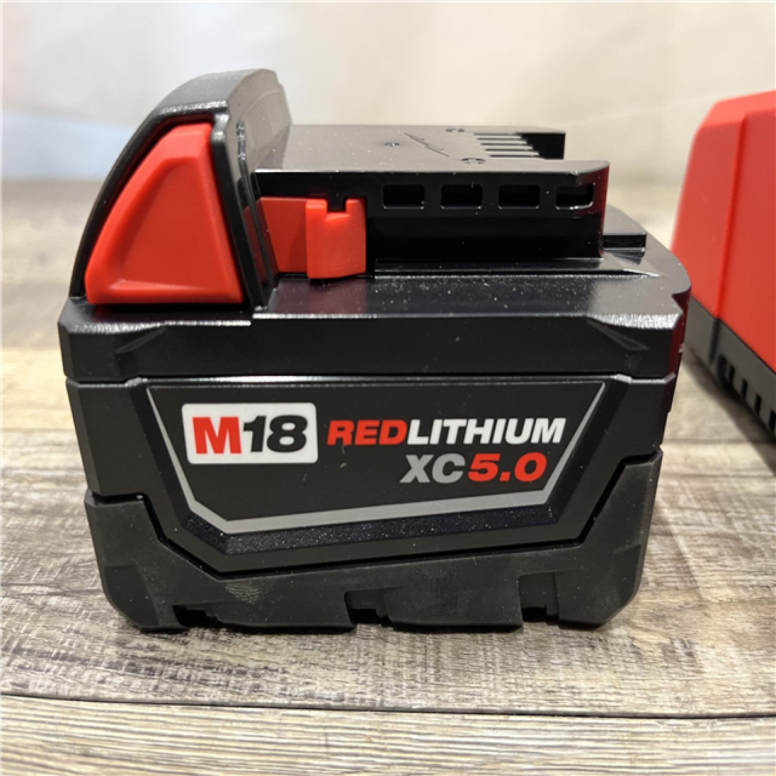 AS-IS Milwaukee 18-Volt Lithium-Ion XC Starter Kit with One 5.0Ah Battery and Charger