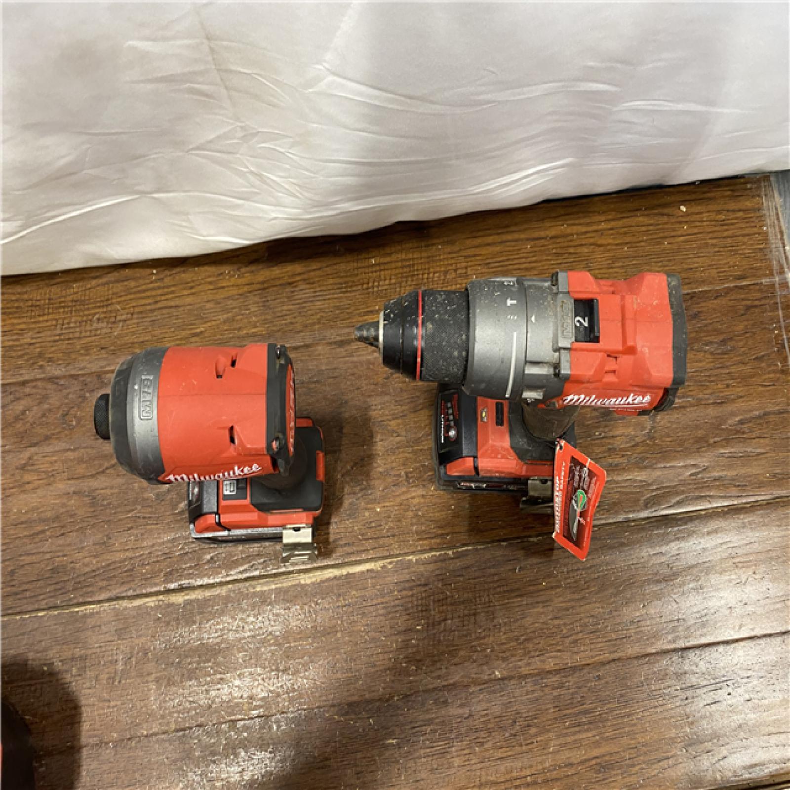 AS-IS MILWAUKEE M18 FUEL 18V Lithium-Ion Brushless Cordless Hammer Drill and Impact Driver Combo Kit (2-Tool) with 2 Batteries