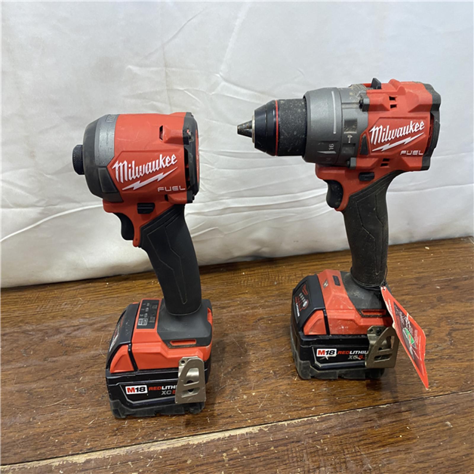 AS-IS MILWAUKEE M18 FUEL 18V Lithium-Ion Brushless Cordless Hammer Drill and Impact Driver Combo Kit (2-Tool) with 2 Batteries
