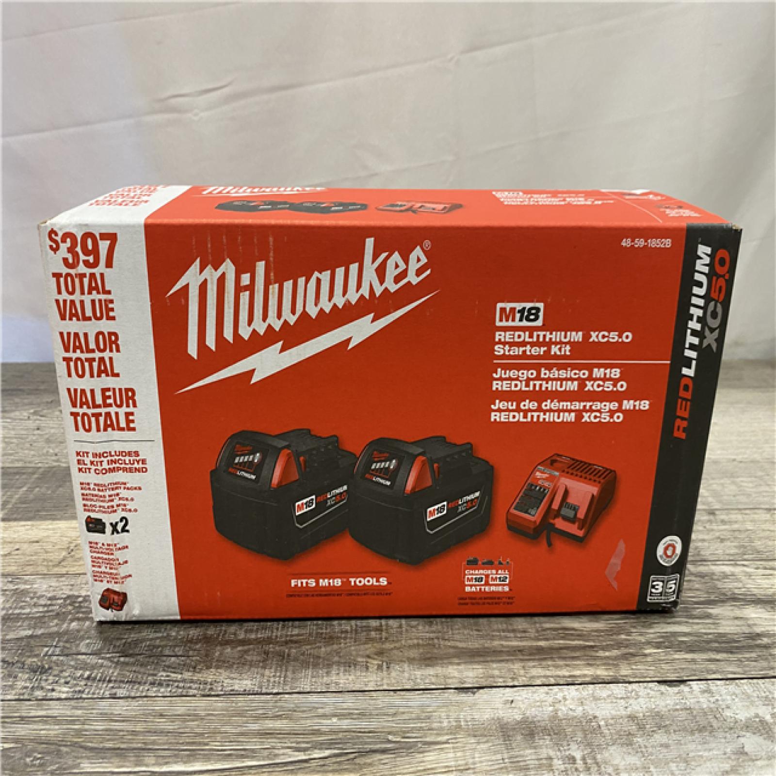 NEW - Milwaukee 18-Volt Lithium-Ion XC Starter Kit with Two 5.0Ah Batteries and Charger