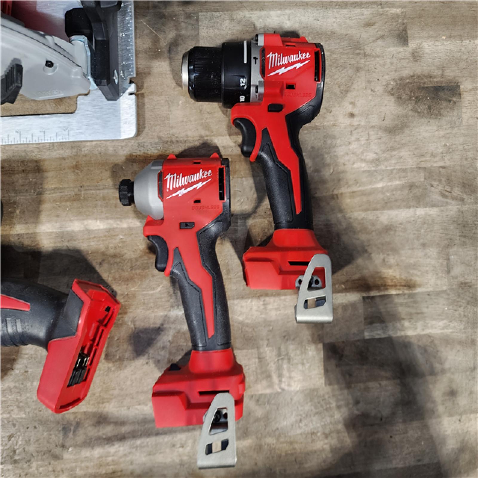 HOUSTON LOCATION - AS-IS Milwaukee M18 18-Volt Lithium-Ion Brushless Cordless Combo Kit (4-Tool) with 2-Batteries  1-Charger and Tool Bag