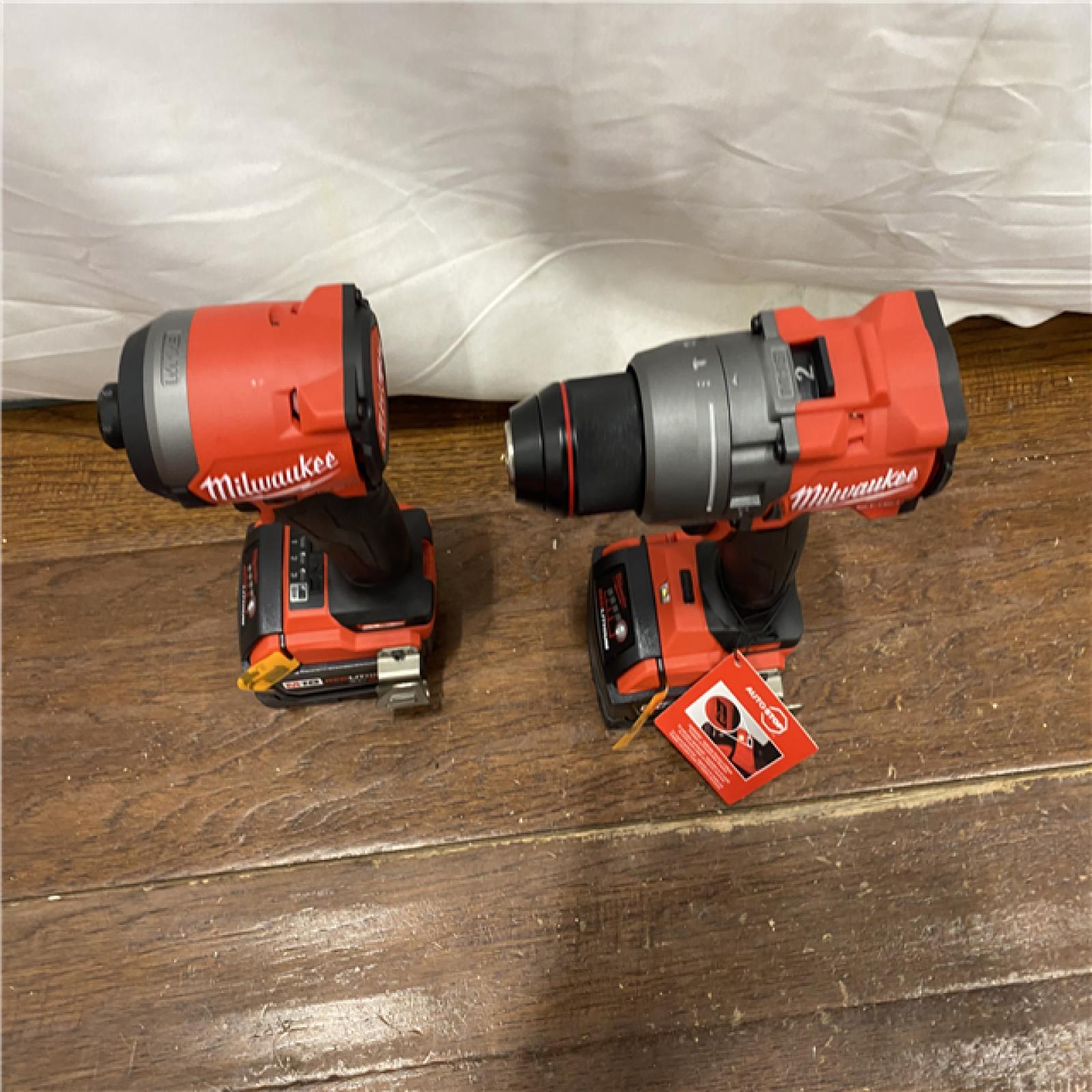 AS-IS MILWAUKEE M18 FUEL 18V Lithium-Ion Brushless Cordless Hammer Drill and Impact Driver Combo Kit (2-Tool) with 2 Batteries