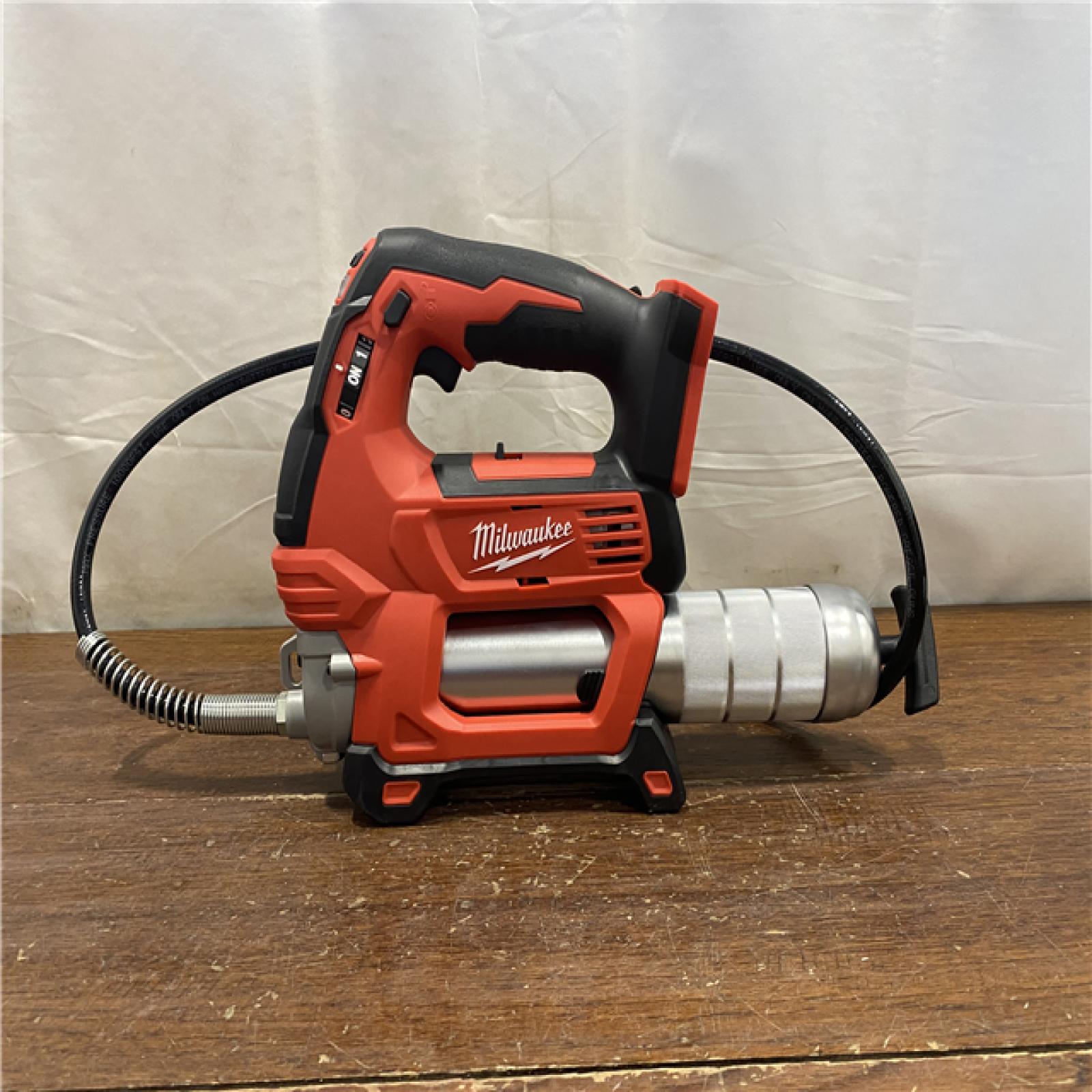 AS-IS Milwaukee Tool 10,000 PSI 14 Oz Battery-Operated Grease Gun - 48 Flexible Hose, 31 Strokes/oz | Part #2646-20