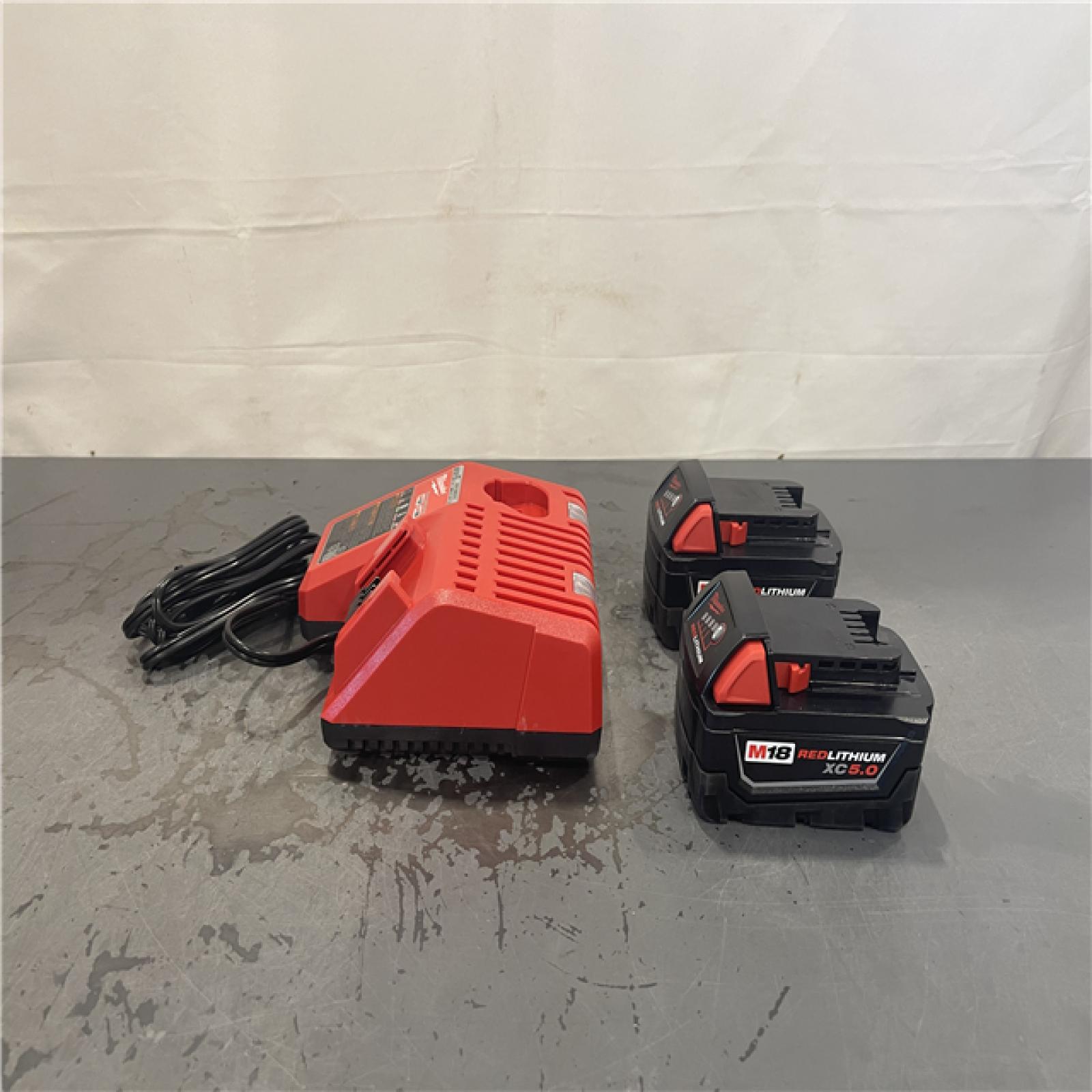 AS-IS- Milwaukee M18 18-Volt Lithium-Ion XC Starter Kit with Two 5.0Ah Batteries and Charger