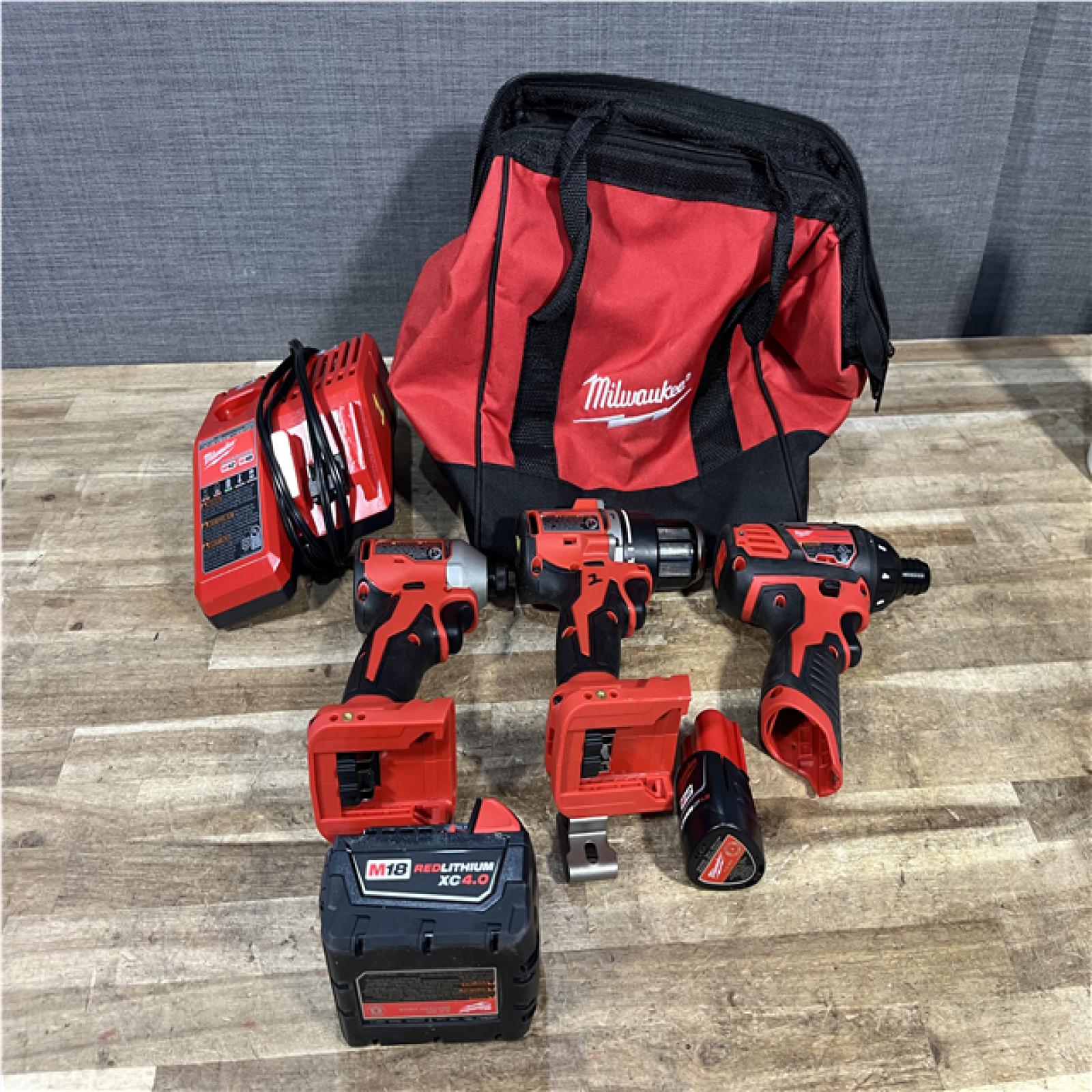 Houston Location AS-IS Milwaukee Hammer Drill Driver and Impact Driver and Screwdriver and Batteries QTY/2 with Charger