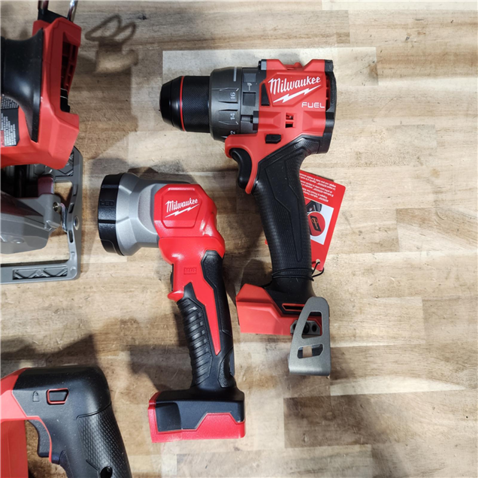 HOUSTON LOCATION - AS-IS MILWAUKEE 4 TOOL COMBO KIT W/ (2) BATTERY & CHARGER