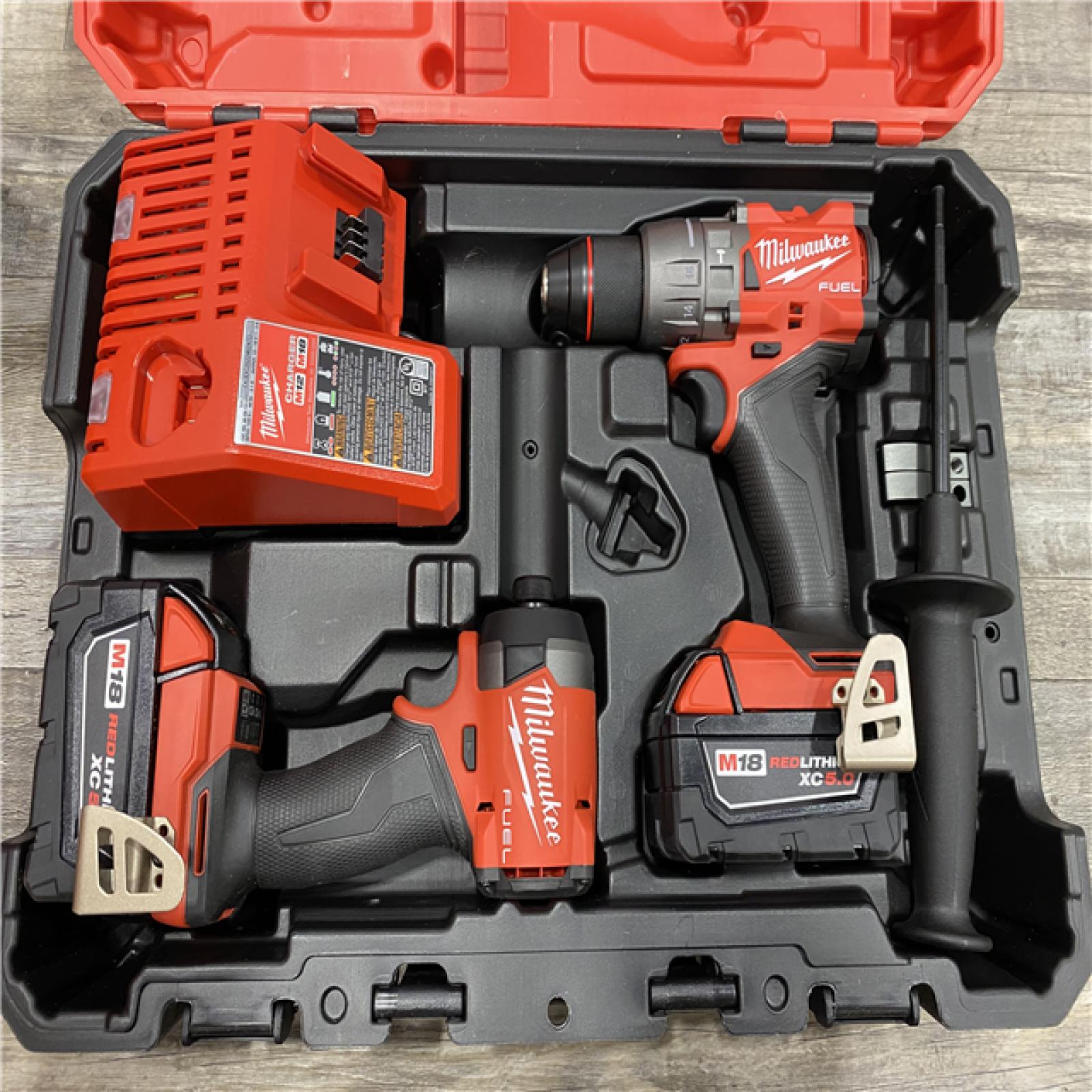 AS-IS Milwaukee FUEL 18V Lithium-Ion Brushless Cordless Hammer Drill and Impact Driver Combo Kit