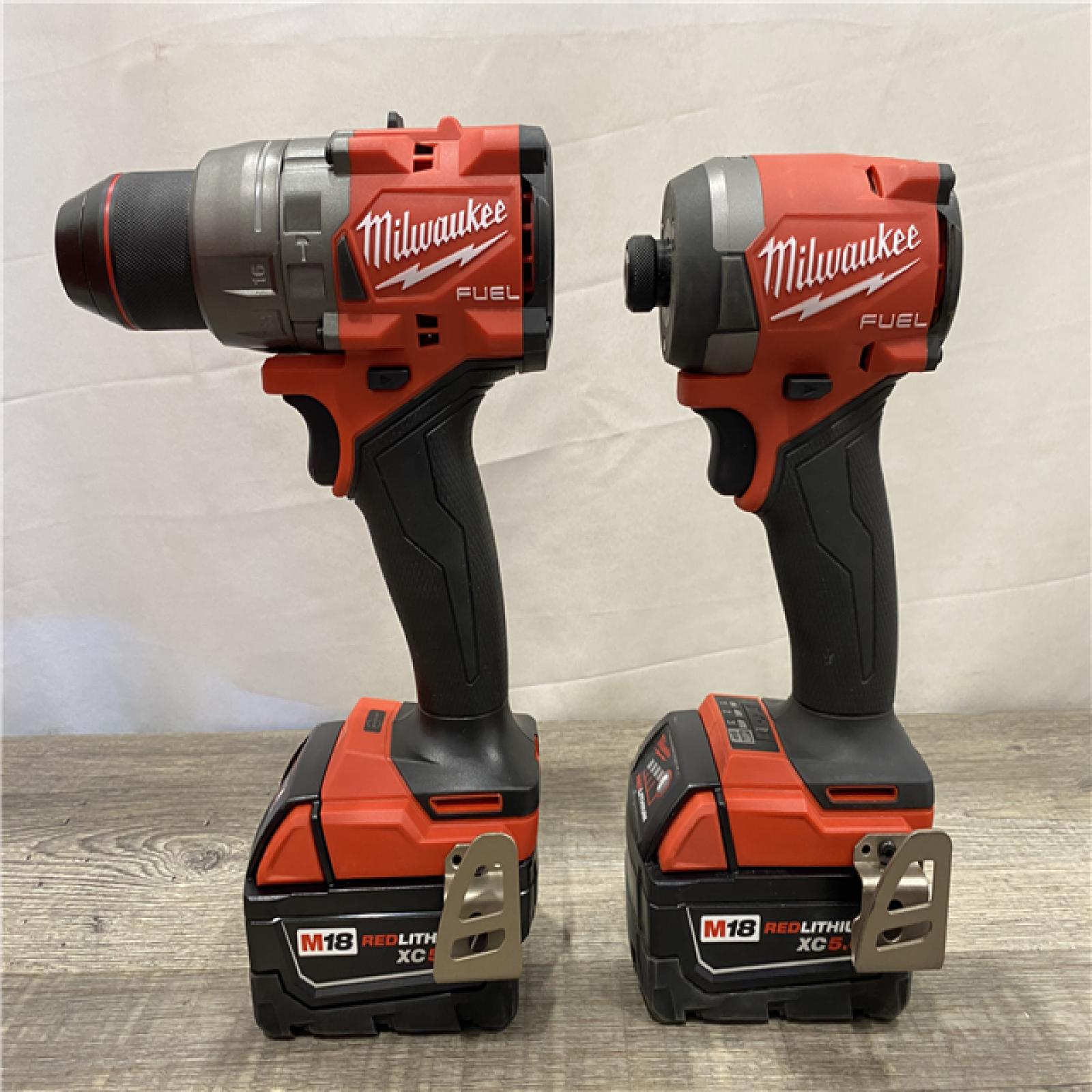 AS-IS Milwaukee FUEL 18V Lithium-Ion Brushless Cordless Hammer Drill and Impact Driver Combo Kit