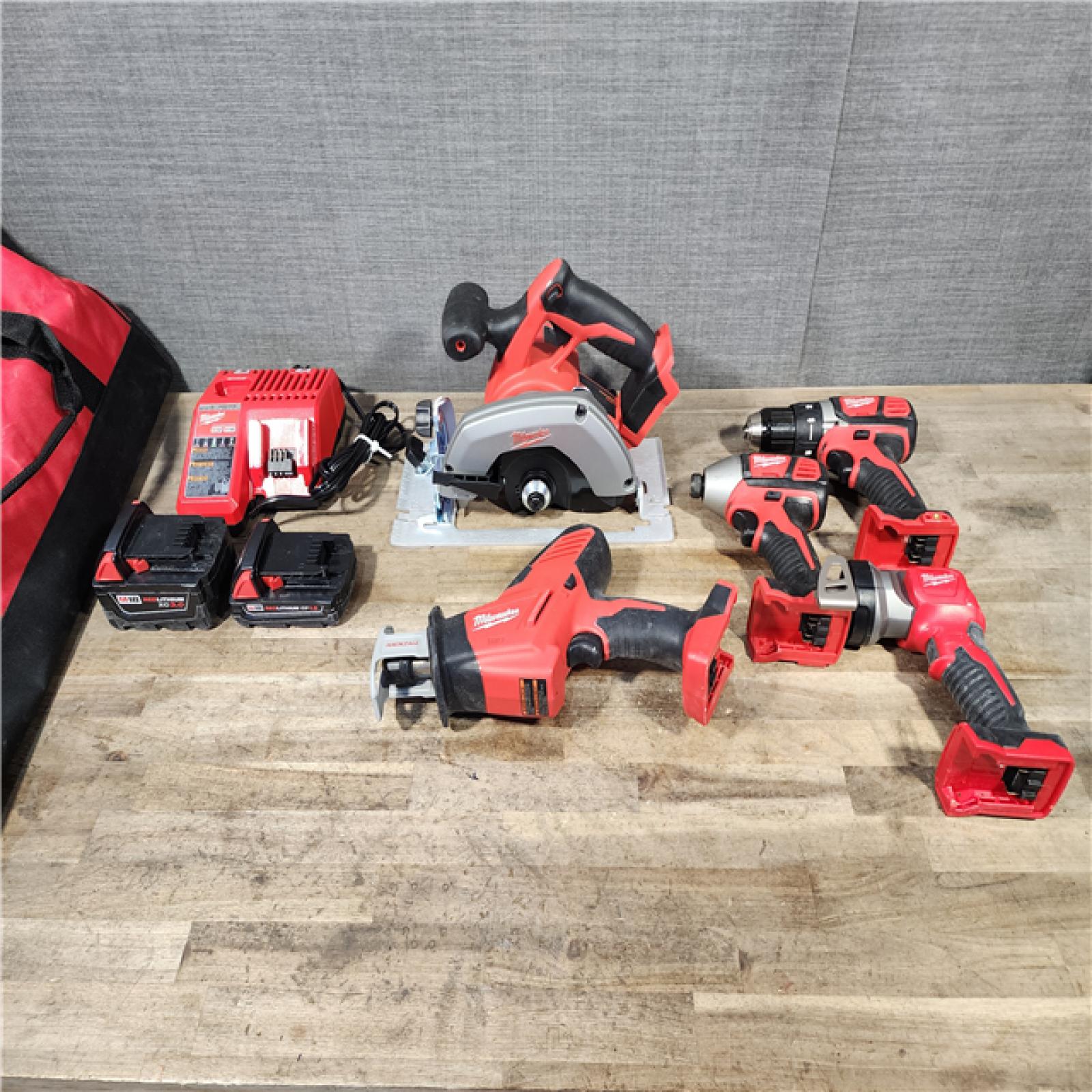 HOUSTON LOCATION - AS-IS M18 18V Lithium-Ion Cordless Combo Kit (5-Tool) with (1) 3.0Ah and (1) 1.5Ah Battery  (1) Charger  (1) Tool Bag