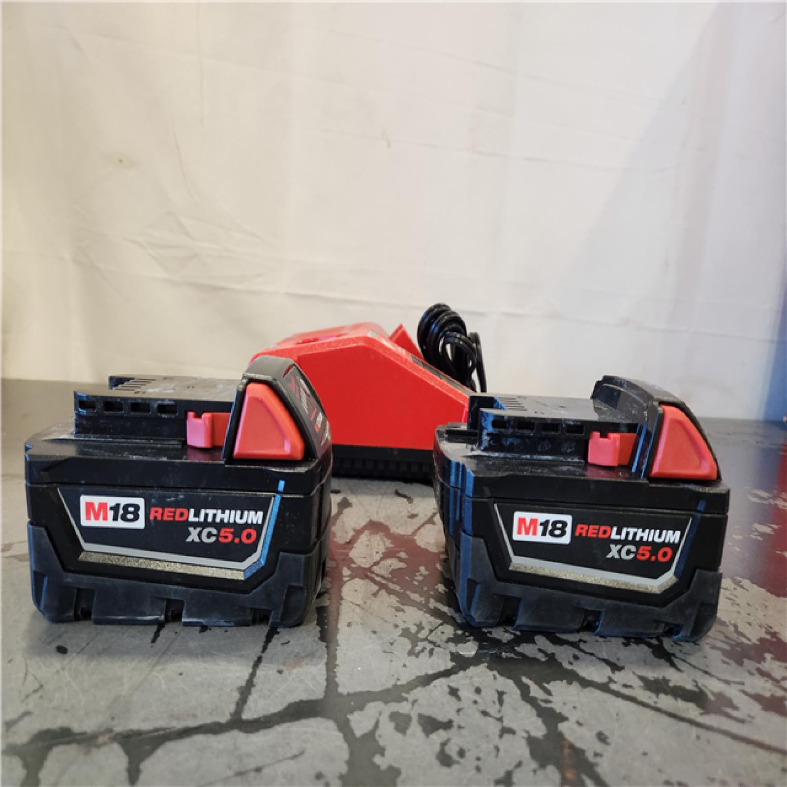 AS-IS- Milwaukee 18-Volt Lithium-Ion XC Starter Kit with Two 5.0Ah Batteries and Charger