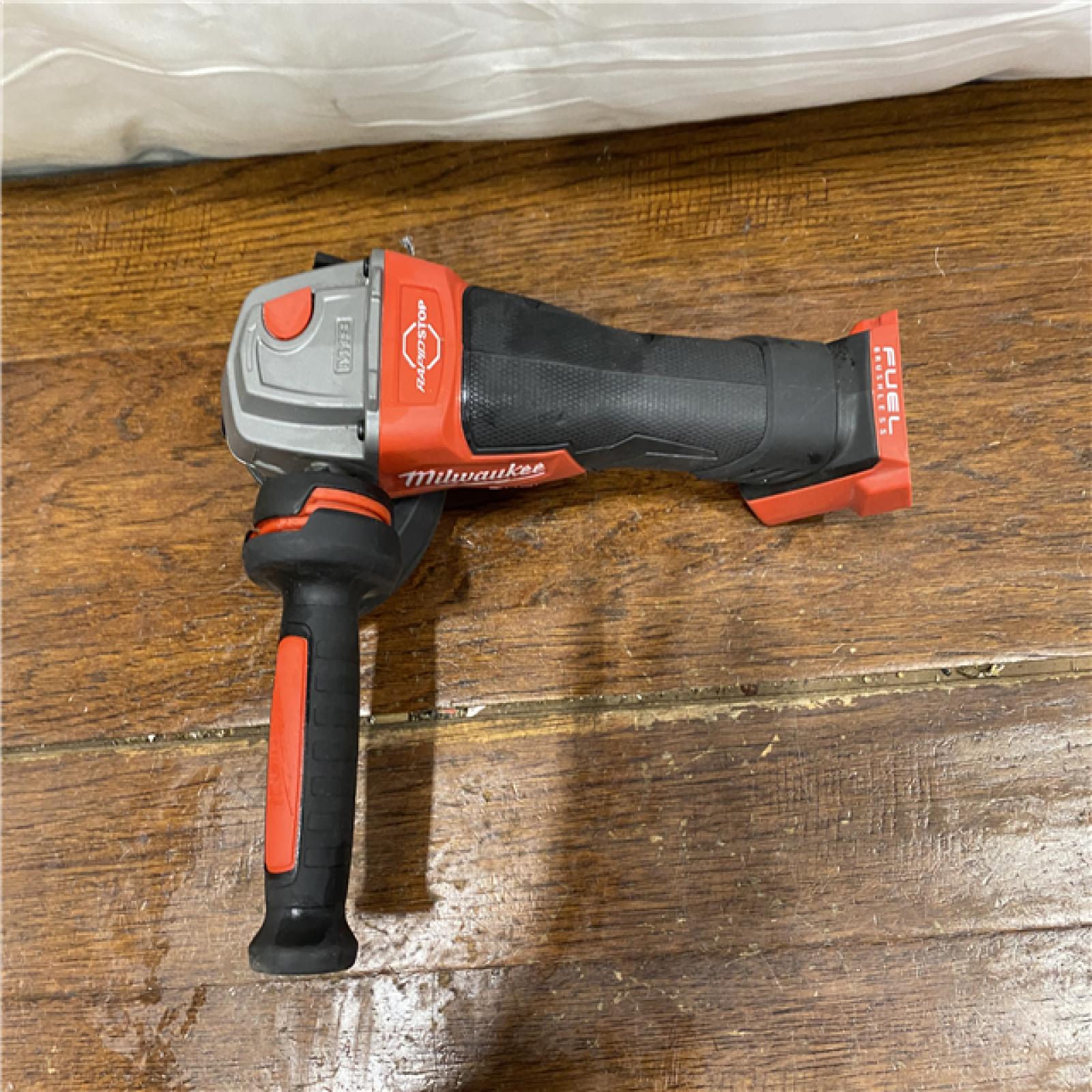 AS-IS Milwaukee 2880-20 M18 FUEL 18-Volt Lithium-Ion Brushless Cordless 4-1/2 in./5 in. Grinder W/Paddle Switch (Tool-Only)