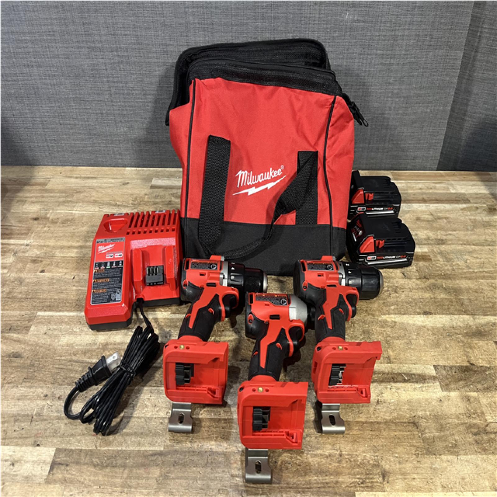 Houston Location AS-IS Milwaukee Hammer Drill Driver and Drill Driver and impact Driver and Batteries QTY/2 with Charger
