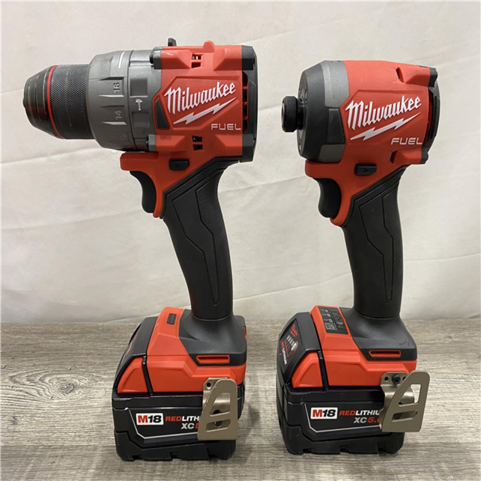 AS-IS Milwaukee FUEL 18V Lithium-Ion Brushless Cordless Hammer Drill and Impact Driver Combo Kit