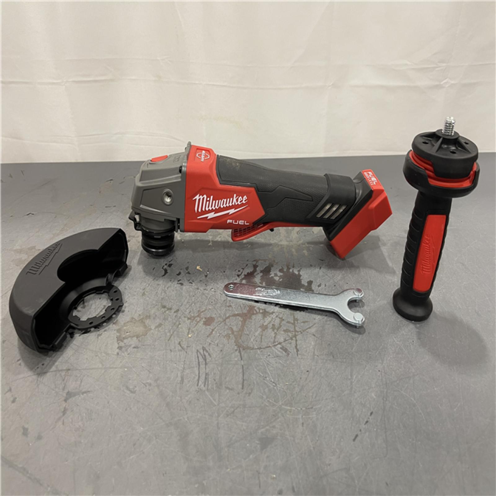 AS-IS - Milwaukee M18 FUEL 18V Lithium-Ion Brushless Cordless 4-1/2 in./5 in. Grinder w/Paddle Switch