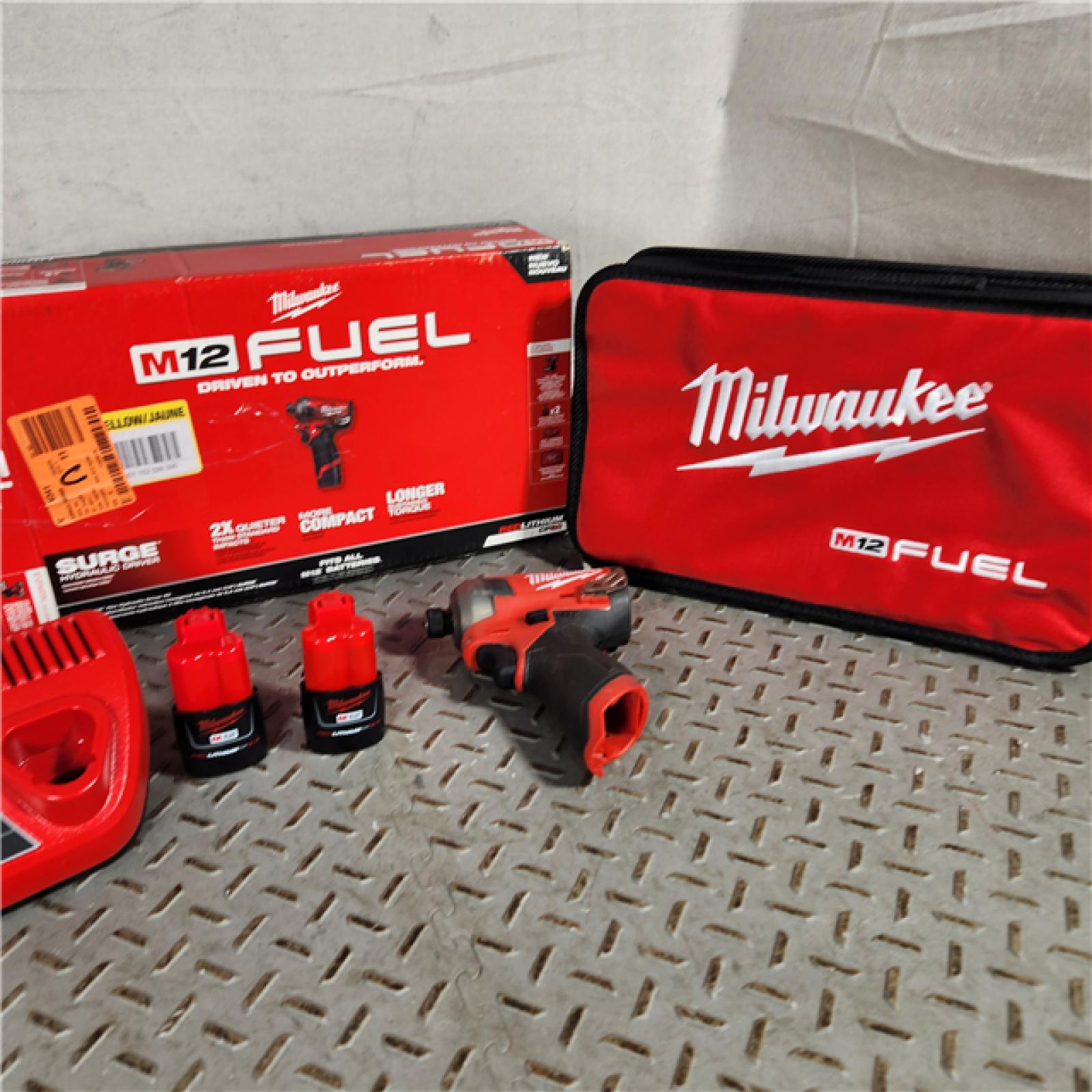 Houston location- AS-IS Milwaukee M12 1/4  12V Brushless Hex Impact Driver Kit 2551-22 with (2) 2Ah Batteries  Charger  & Tool Bag
