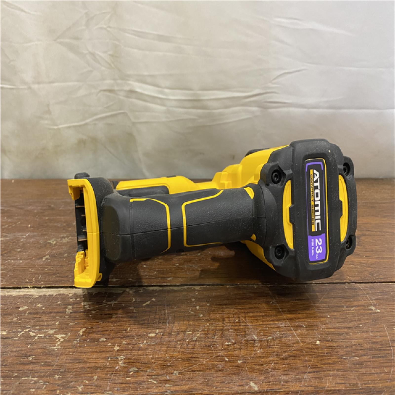 AS-IS DEWALT ATOMIC 20V MAX Lithium Ion Cordless 23 Gauge Pin Nailer Kit with 3.0Ah Battery and Charger