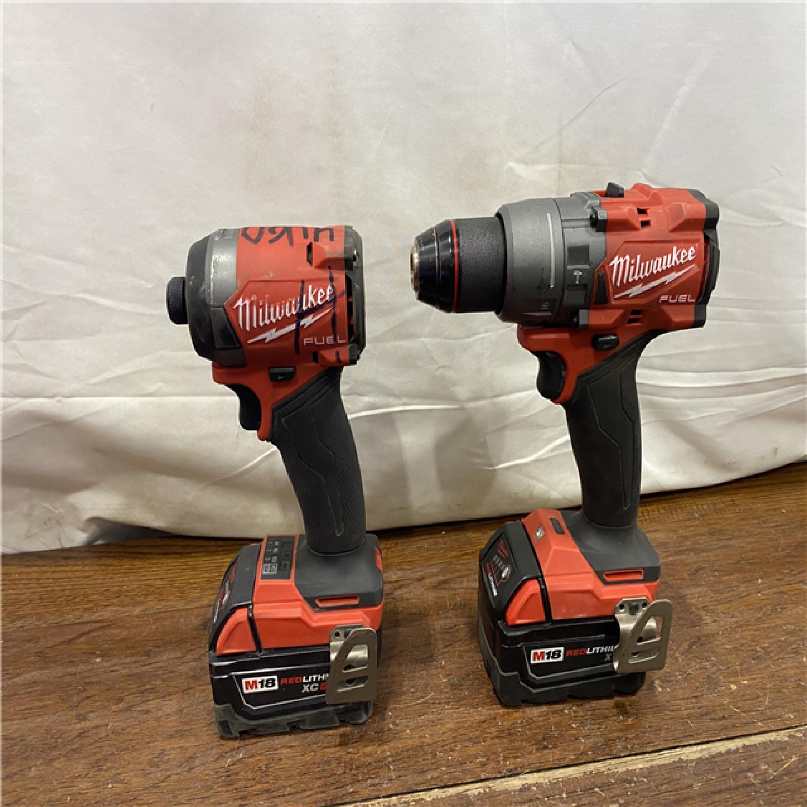 AS-IS MILWAUKEE M18 FUEL 18V Lithium-Ion Brushless Cordless Hammer Drill and Impact Driver Combo Kit (2-Tool) with 2 Batteries