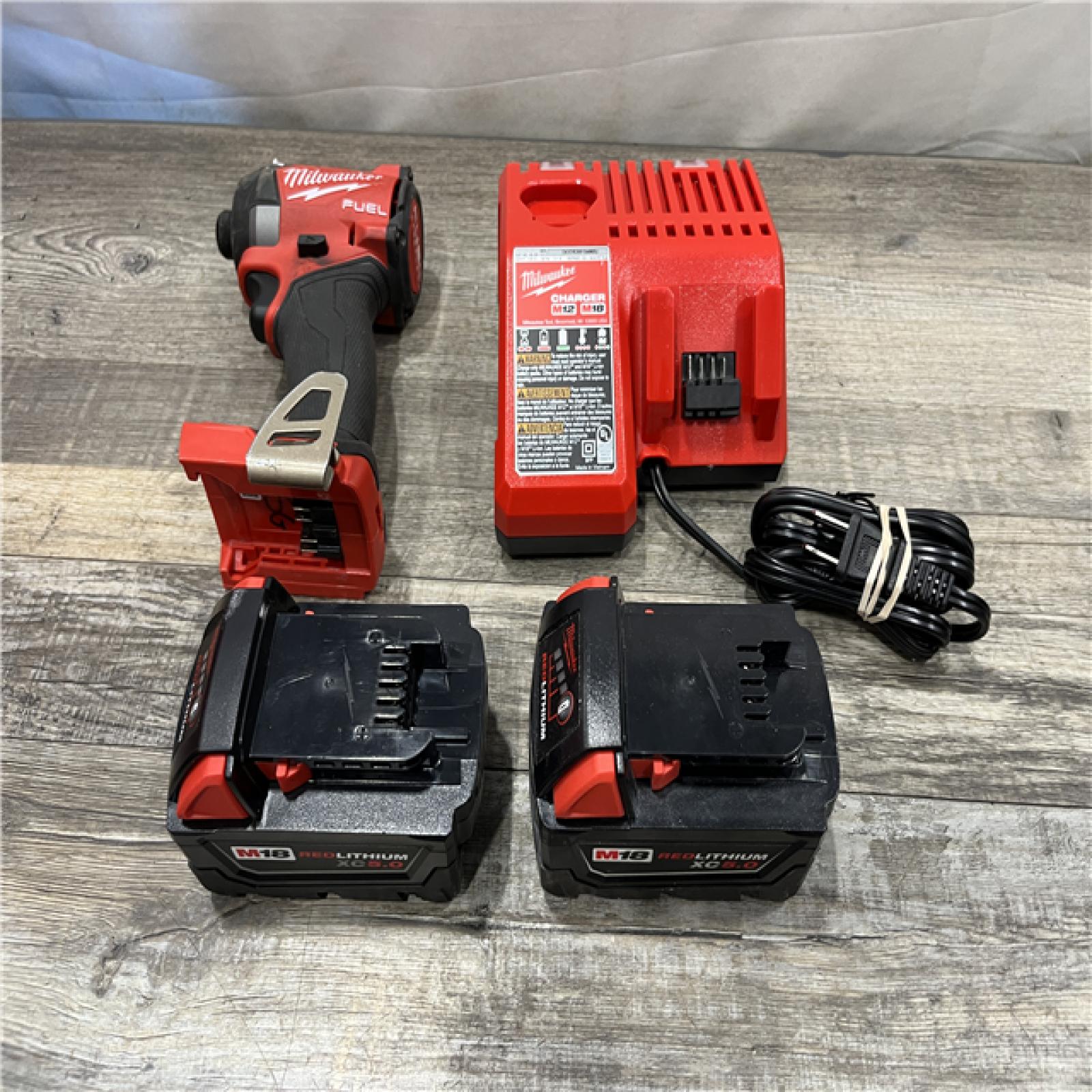 AS-IS Milwaukee FUEL 18V Lithium-Ion Brushless Cordless 1/4 in. Hex Impact Driver Kit
