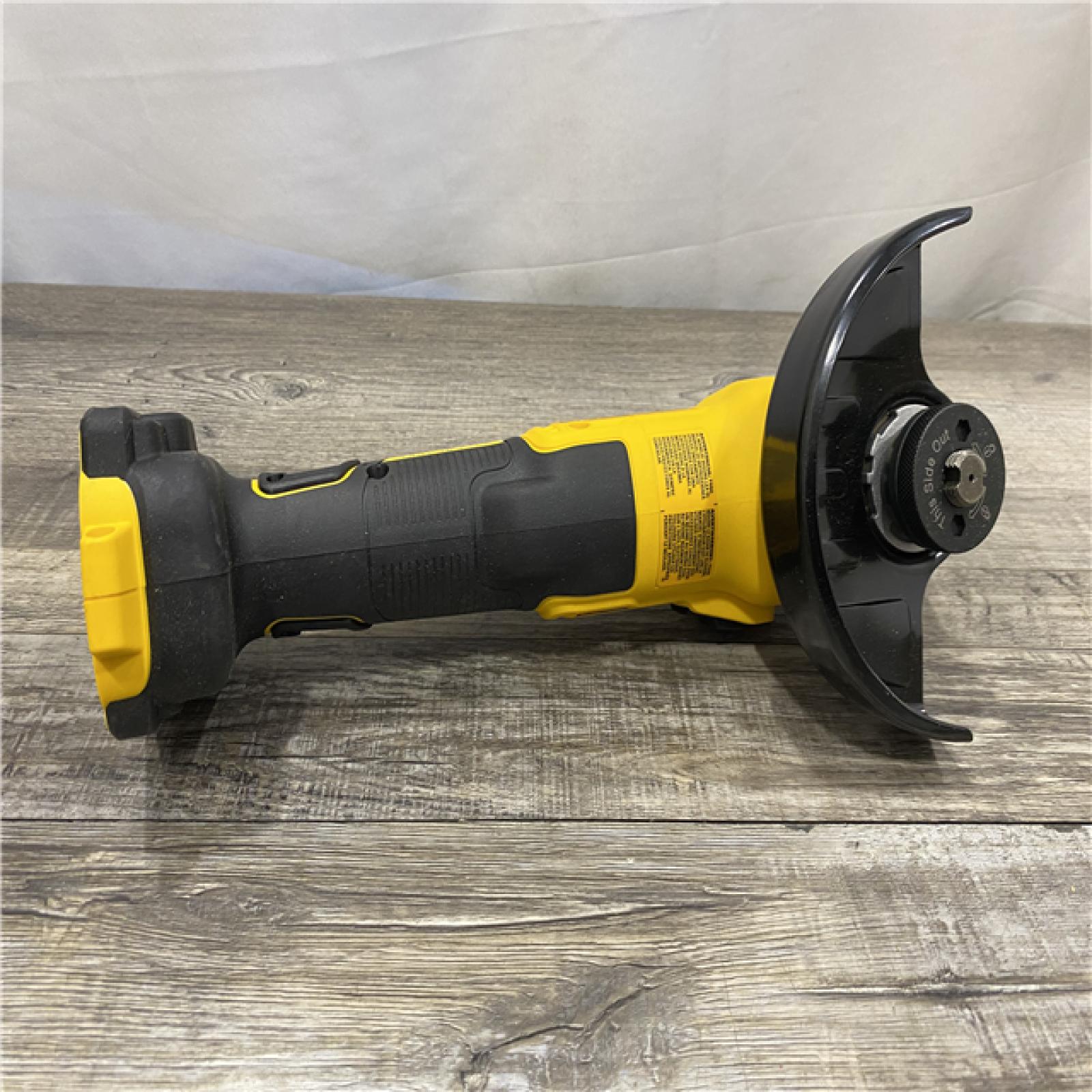 AS-IS DEWALT 20-Volt Max XR Brushless Cordless 4-1/2 in. - 5 in. Variable Speed Angle Grinder with Slide Switch (Tool Only)