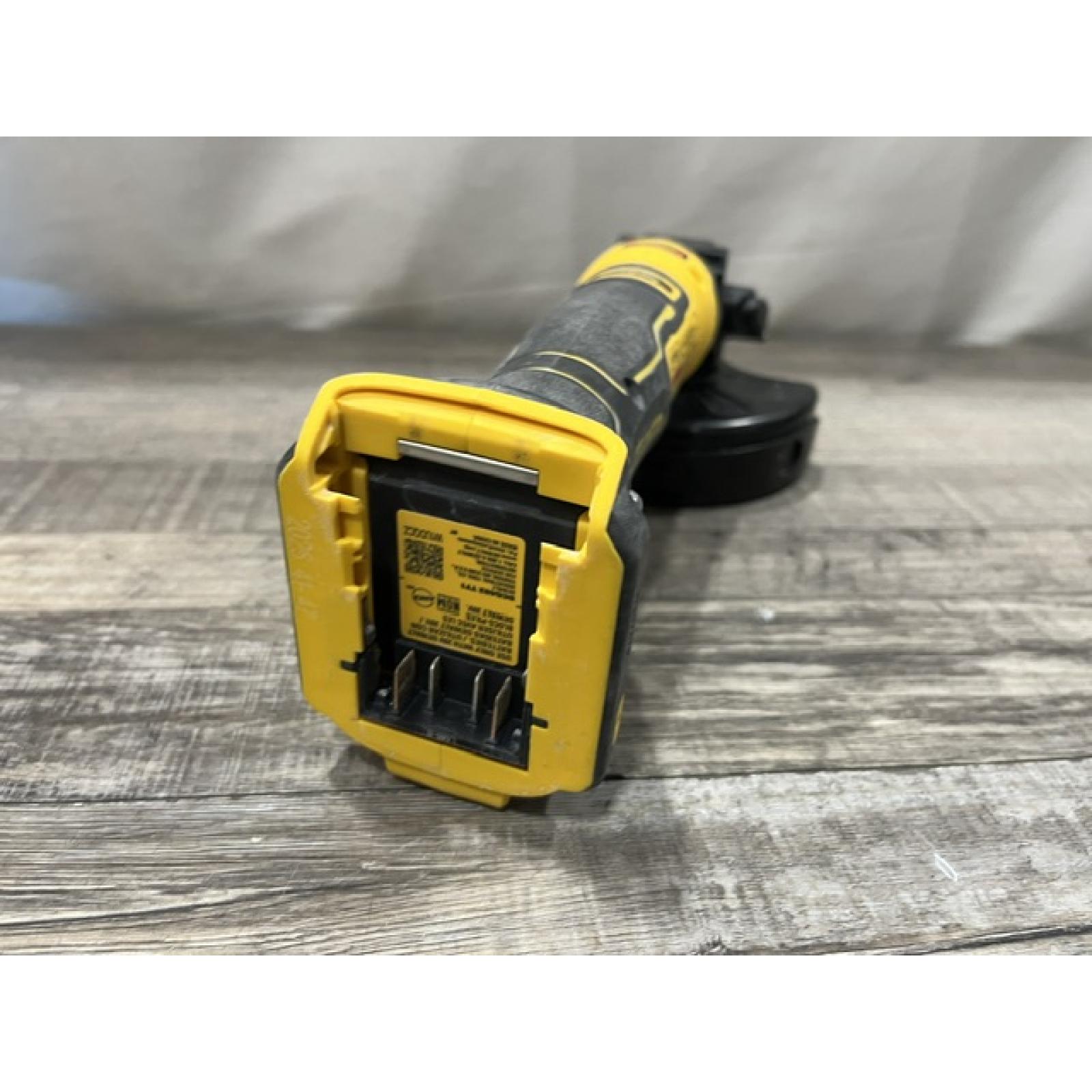 AS-IS DEWALT ATOMIC 20V MAX Cordless 4-1/2 in. Angle Grinder with Paddle Switch (Tool Only)