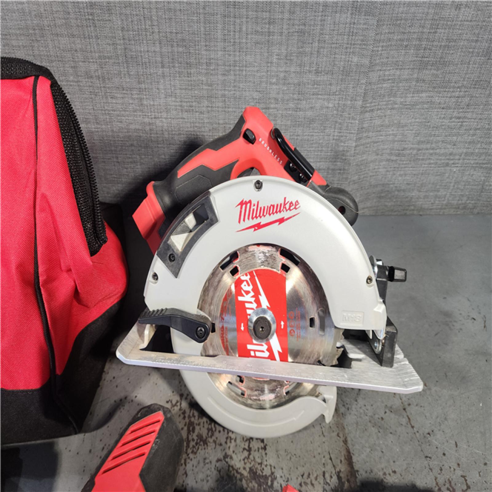 HOUSTON LOCATION - AS-IS AS-IS Milwaukee M18 18-Volt Lithium-Ion Brushless Cordless Combo Kit (4-Tool) with 2-Batteries, 1-Charger and Tool Bag