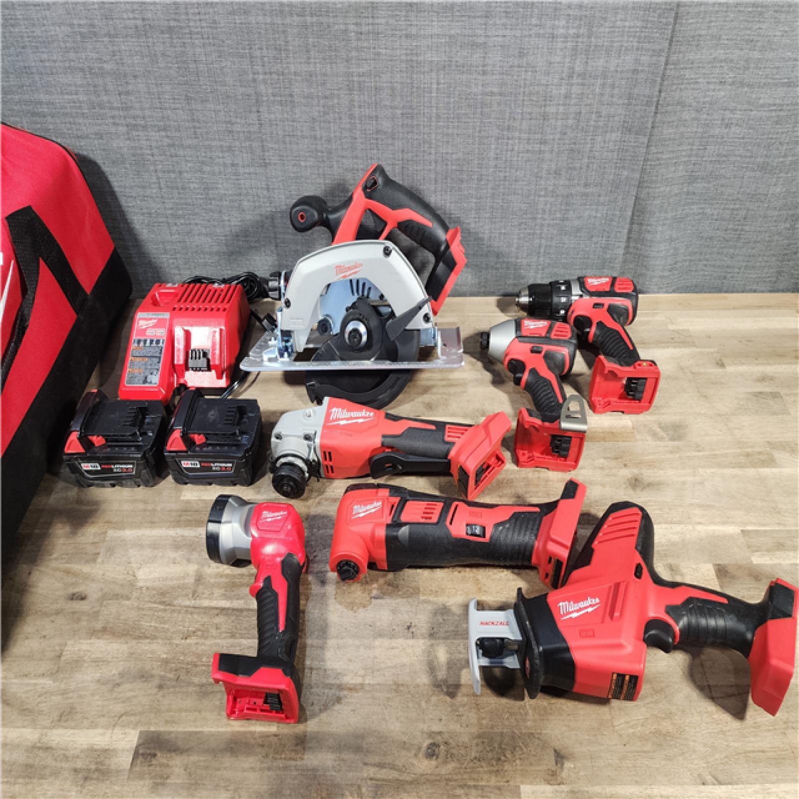HOUSTON LOCATION - AS-IS Milwaukee M18 18-Volt Lithium-Ion Cordless Combo Kit 7-Tool with 2-Batteries, Charger and Tool Bag