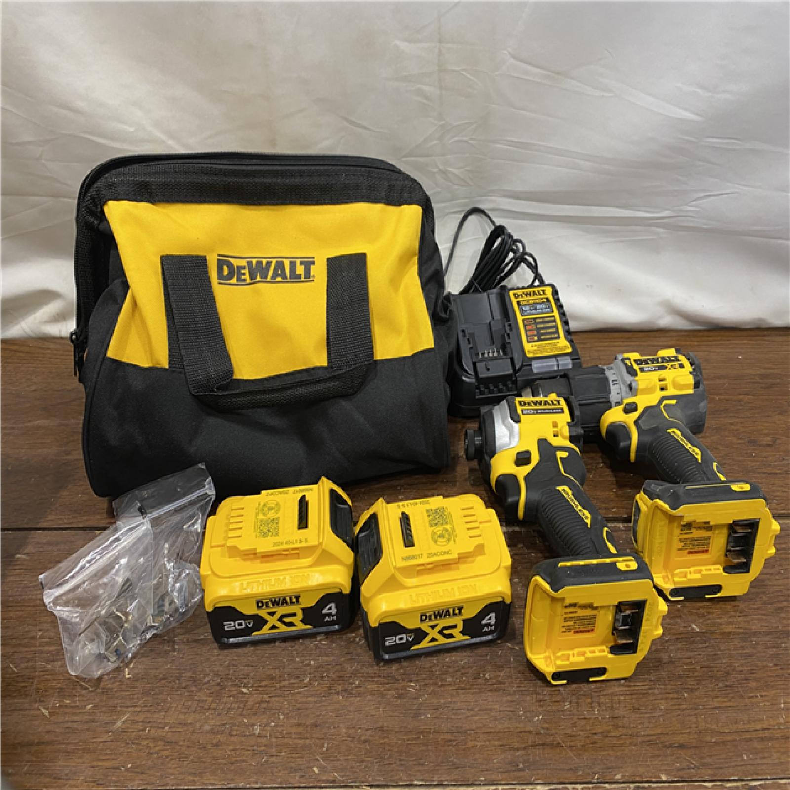 AS-IS DEWALT 20V MAX XR Hammer Drill and ATOMIC Impact Driver 2 Tool Cordless Combo Kit with (2) 4.0Ah Batteries, Charger, and Bag
