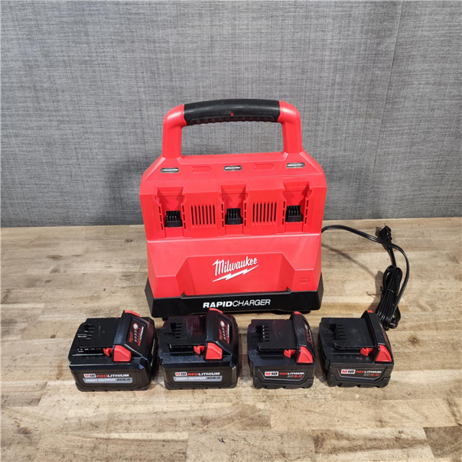 HOUSTON LOCATION - AS-IS Milwaukee 18-Volt Lithium-Ion Battery Pack (2) 5.0Ah and High Output Battery Pack (2) 6.0Ah with PACKOUT 6-Port Rapid Charger