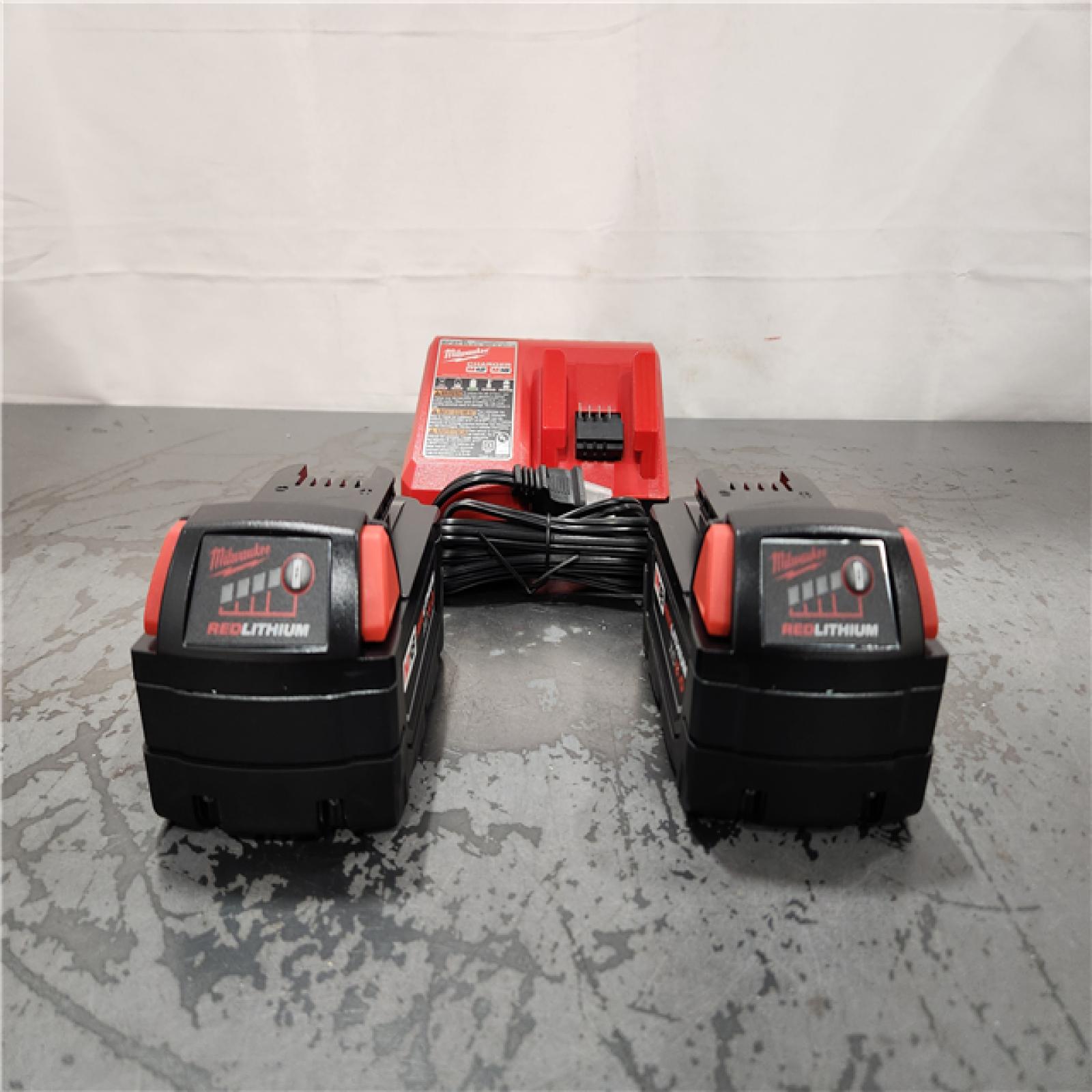 AS-IS- Milwaukee  18-Volt Lithium-Ion XC Starter Kit with Two 5.0Ah Batteries and Charger