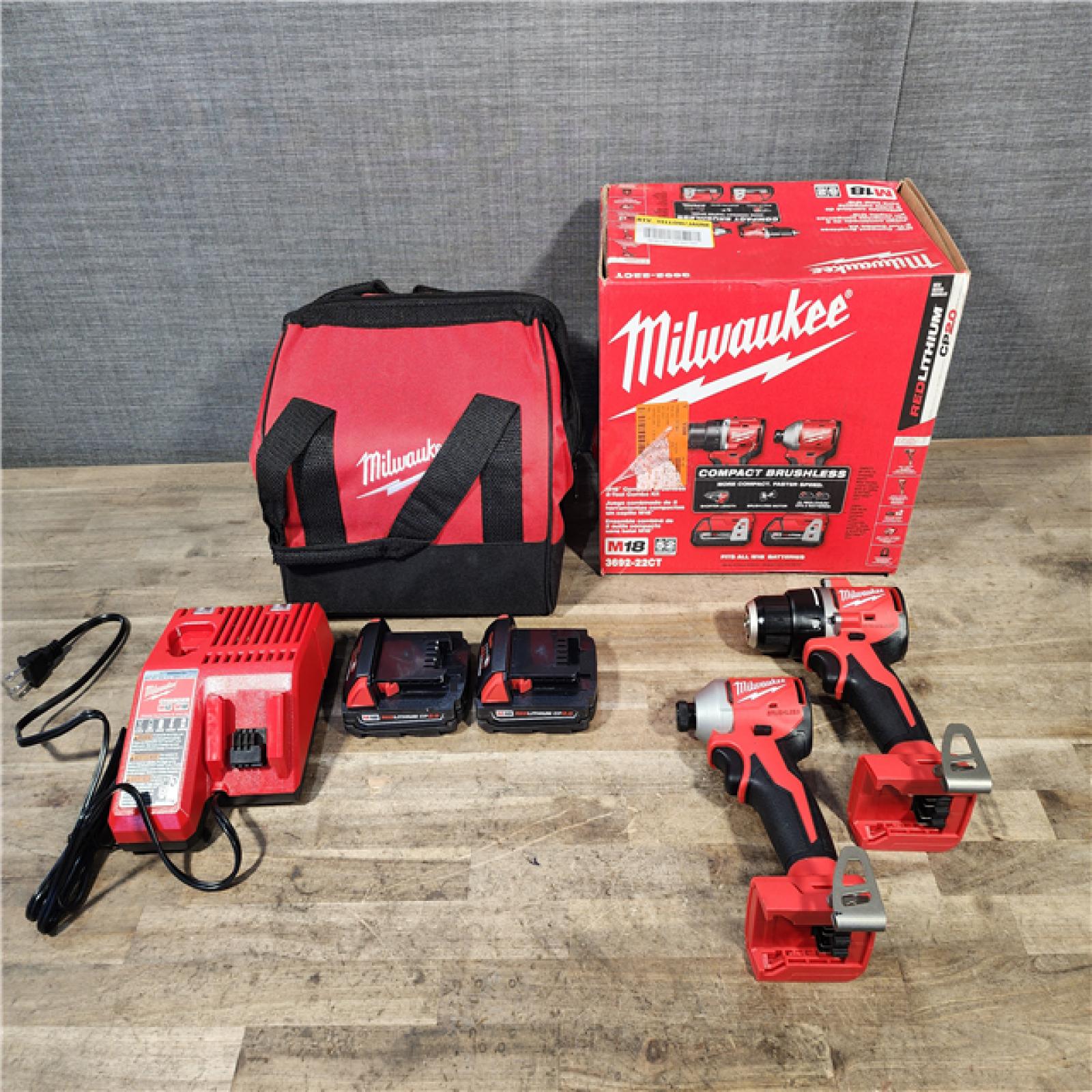 HOUSTON LOCATION - AS-IS Milwaukee M18 18V Lithium-Ion Brushless Cordless Compact Drill/Impact Combo Kit (2-Tool) W/(2) 2.0 Ah Batteries  Charger & Bag