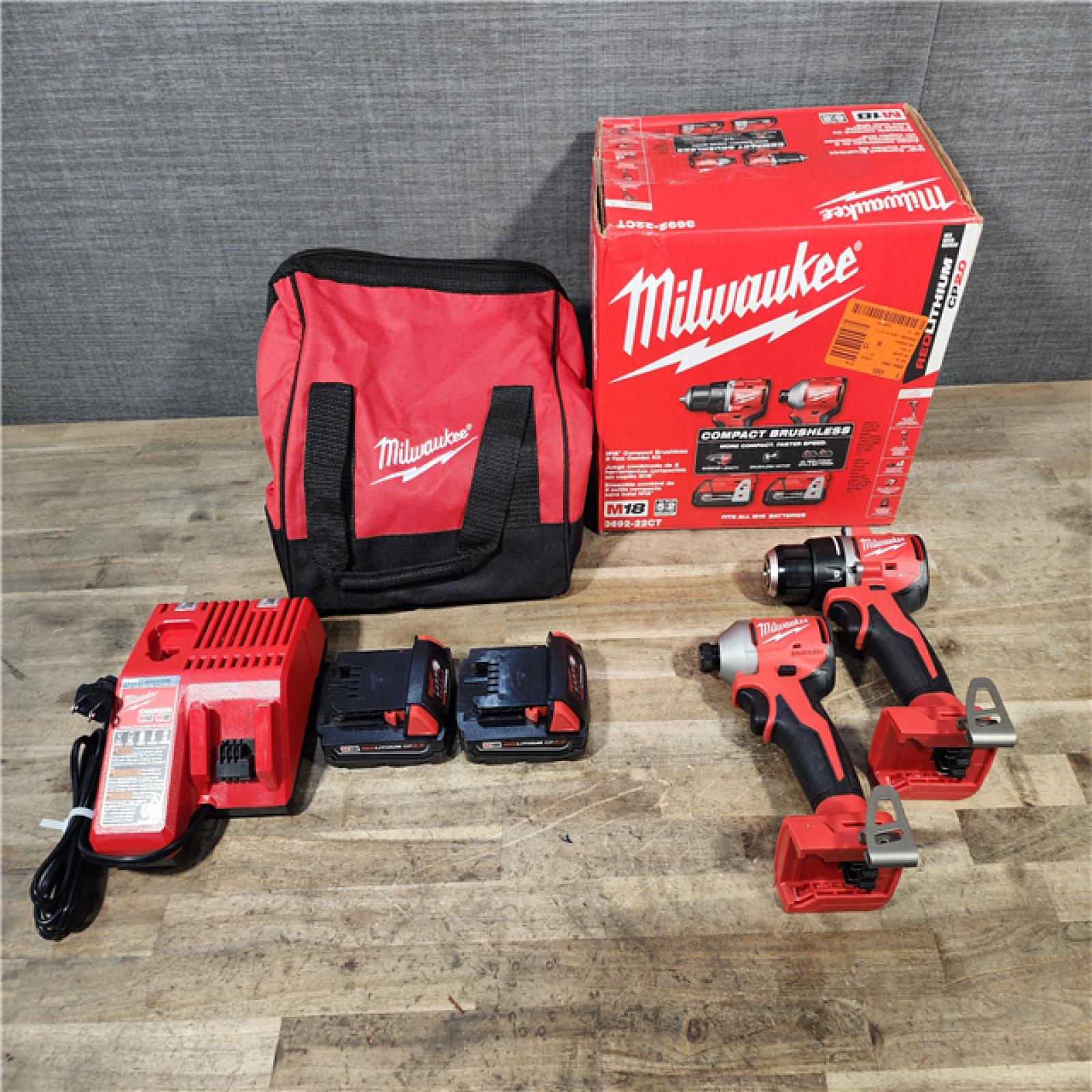 HOUSTON LOCATION - AS-IS Milwaukee M18 18V Lithium-Ion Brushless Cordless Compact Drill/Impact Combo Kit (2-Tool) W/(2) 2.0 Ah Batteries  Charger & Bag