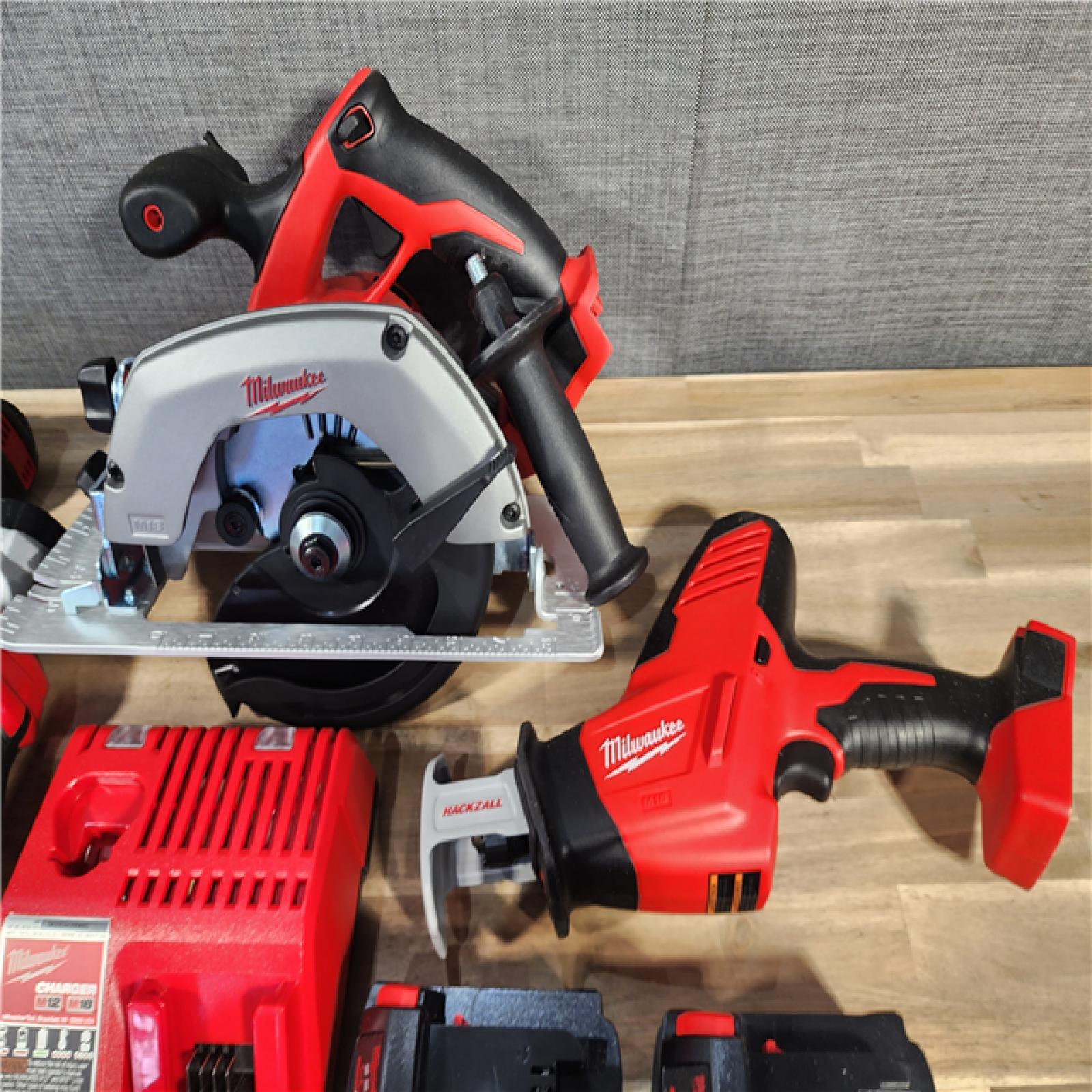 HOUSTON LOCATION - AS-IS (APPEARS LIKE NEW) Milwaukee M18 18-Volt Lithium-Ion Cordless Combo Kit 7-Tool with 2-Batteries, Charger and Tool Bag